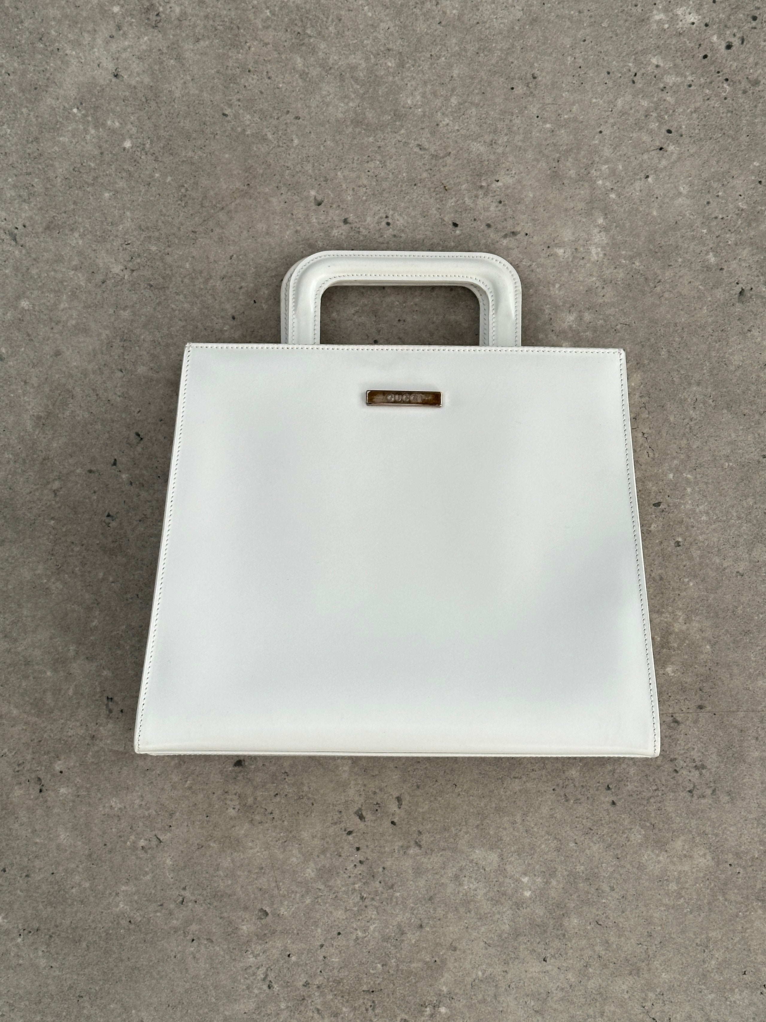 Gucci 1990s Tom Ford 2-in-1 leather and vinyl shoulder bag with sleek design and adjustable strap.