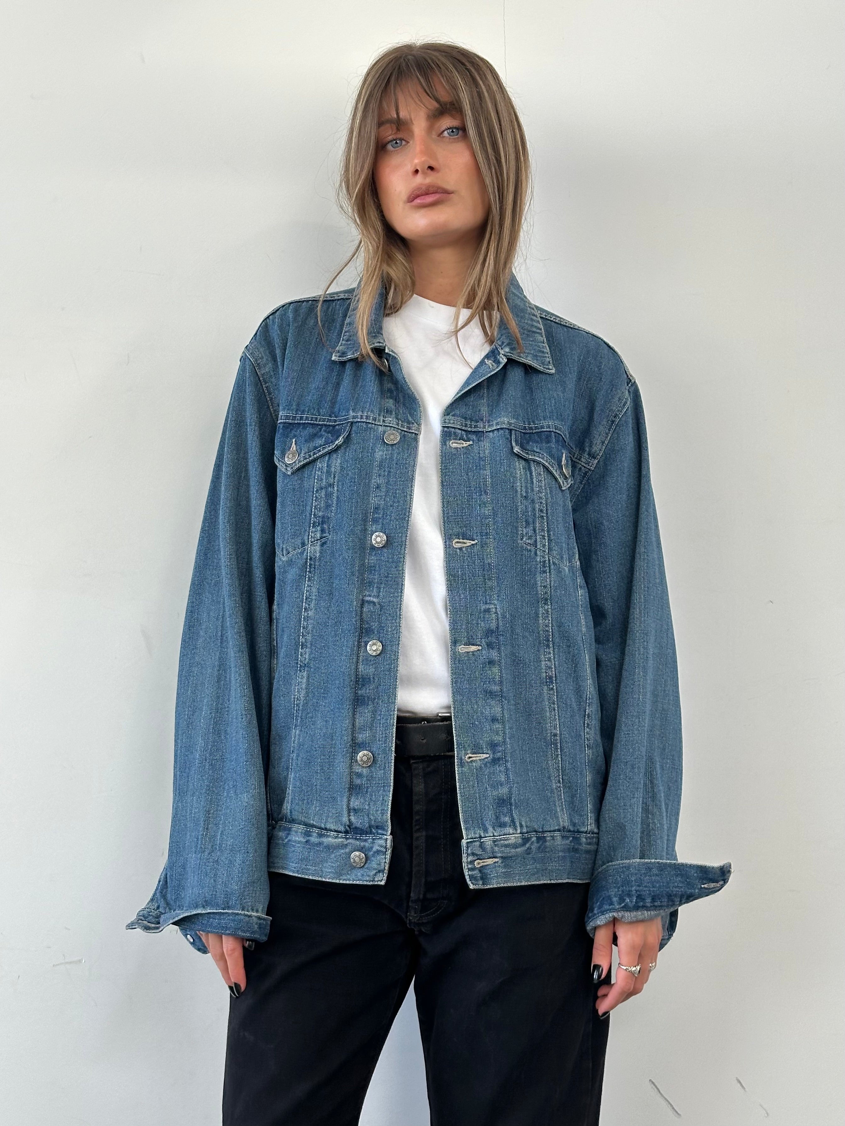 Vintage pure cotton denim jacket in XL size, showcasing classic blue denim with button-front and chest pockets.