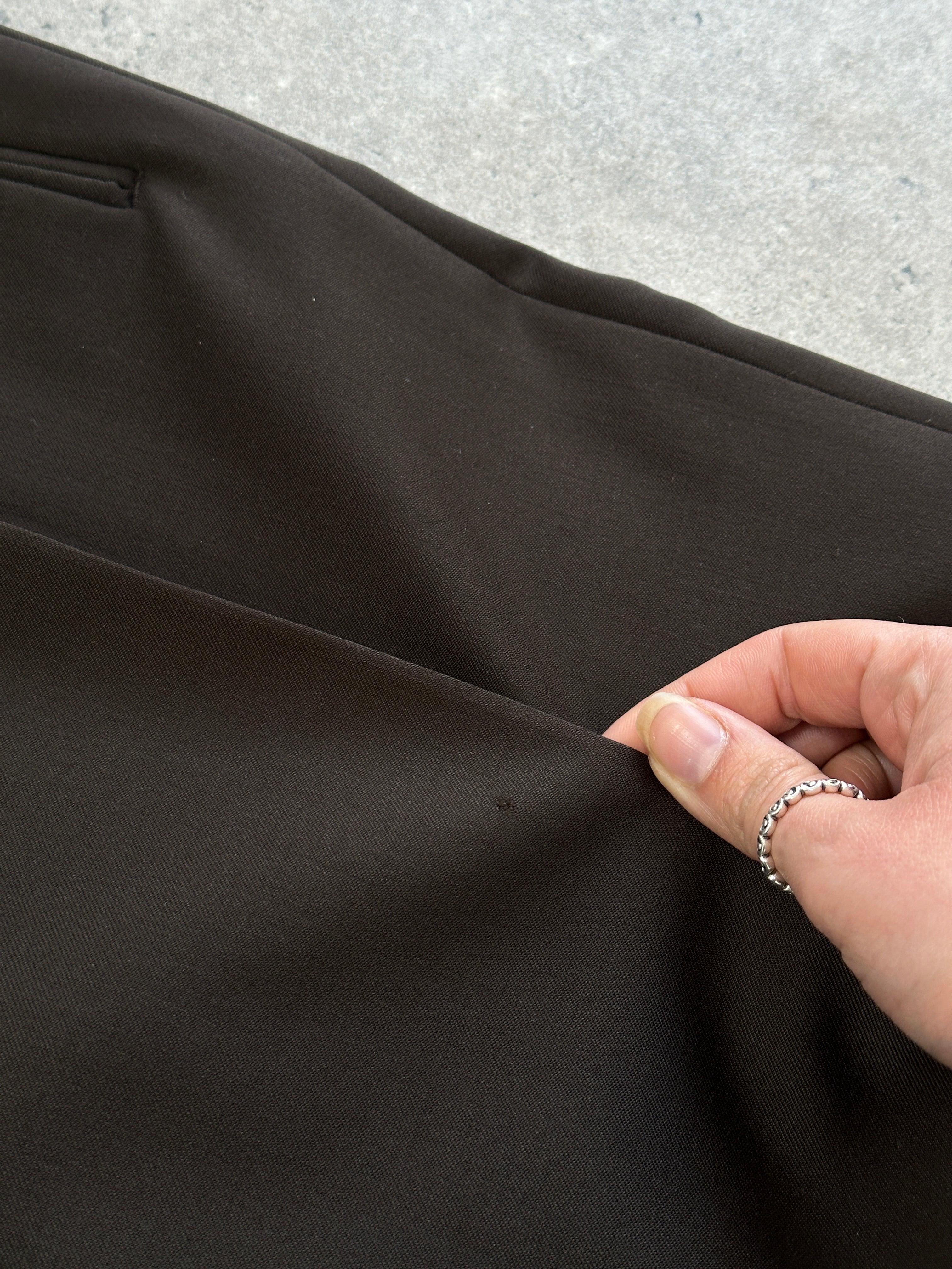 Yves Saint Laurent Pour Homme 1990s tailored wool trousers in size W28, showing a classic fit and dark color fabric.