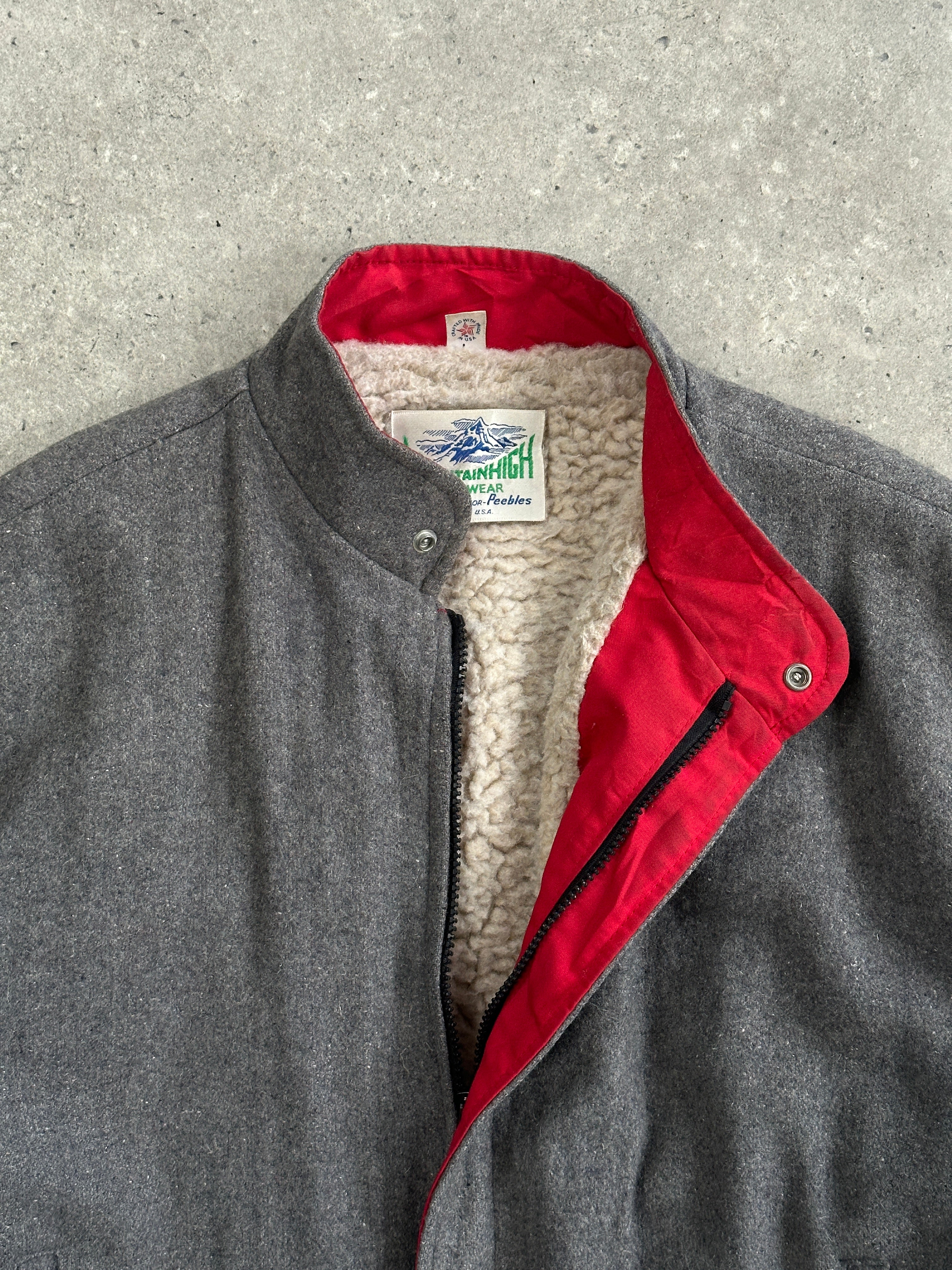 Vintage wool fleece-lined bomber jacket in size large, stylish and warm, featuring classic design and durable fabric.