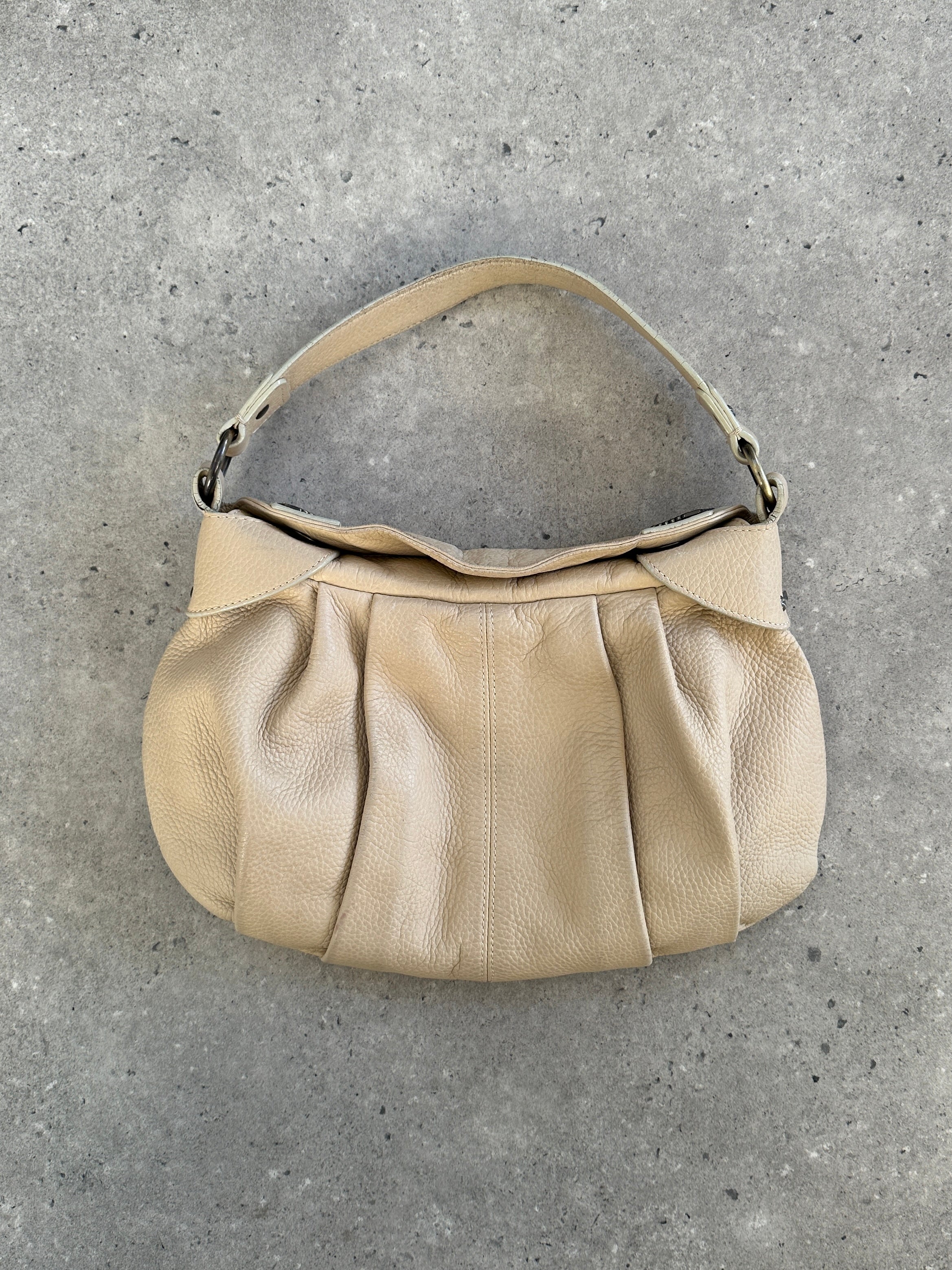 Emporio Armani leather shoulder bag from the 2000s with pleated design, featuring a structured shape and elegant detailing.