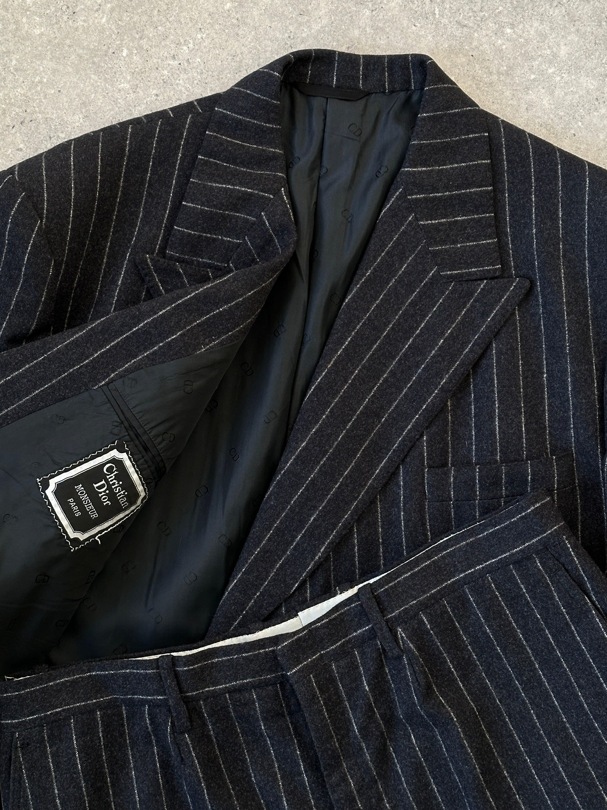 Christian Dior wool double-breasted pinstripe jumpsuit in size 45L/W32, featuring tailored lapels and classic pinstripe pattern.