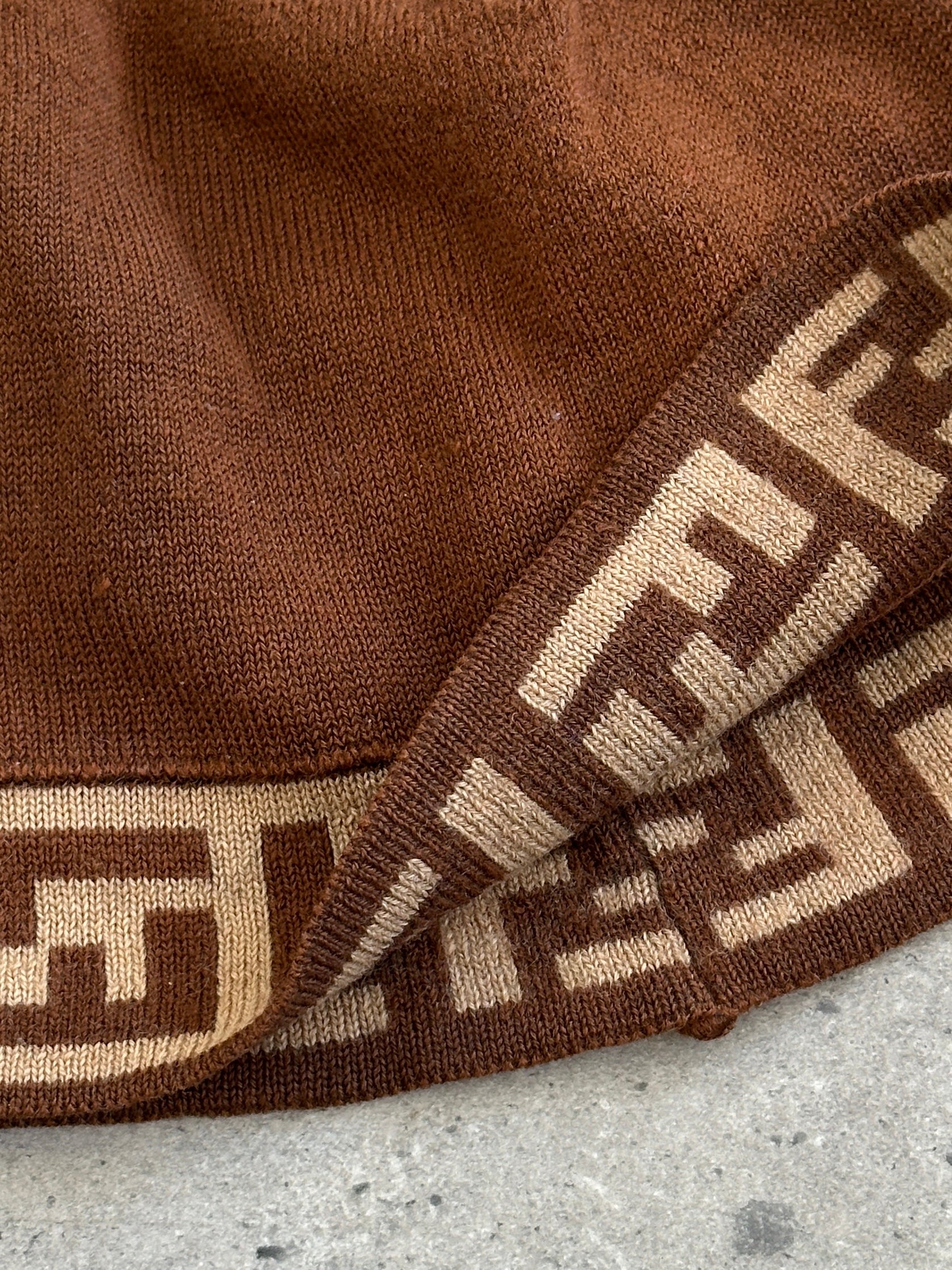 Fendi FF monogram print beanie hat with ribbed knit, stylish and cozy headwear featuring the iconic Fendi logo pattern.