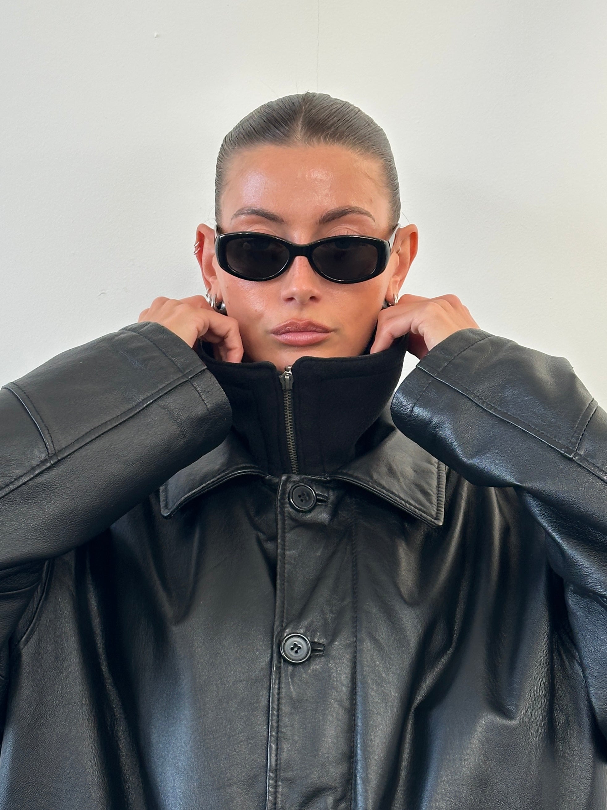Vintage 1990s leather jacket with funnel neck in XXL size, featuring classic style and distressed leather details.