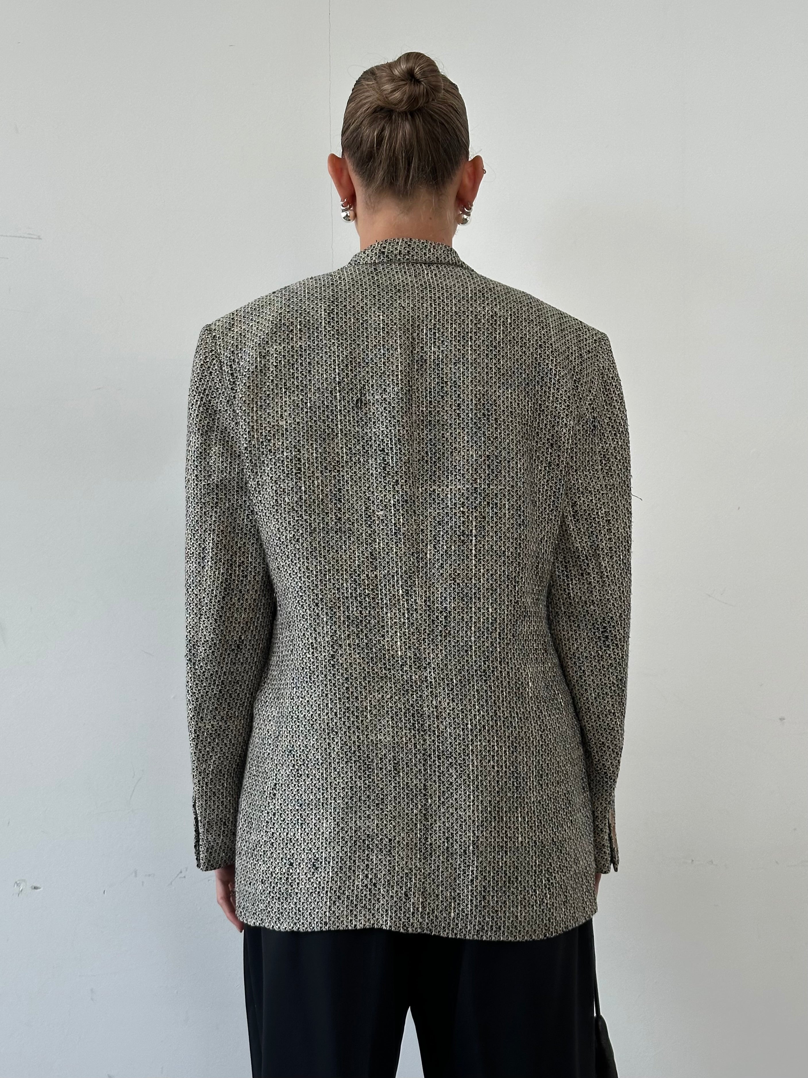 Giorgio Armani Black Label double-breasted blazer in black, tailored fit, with notched lapels and structured shoulders.