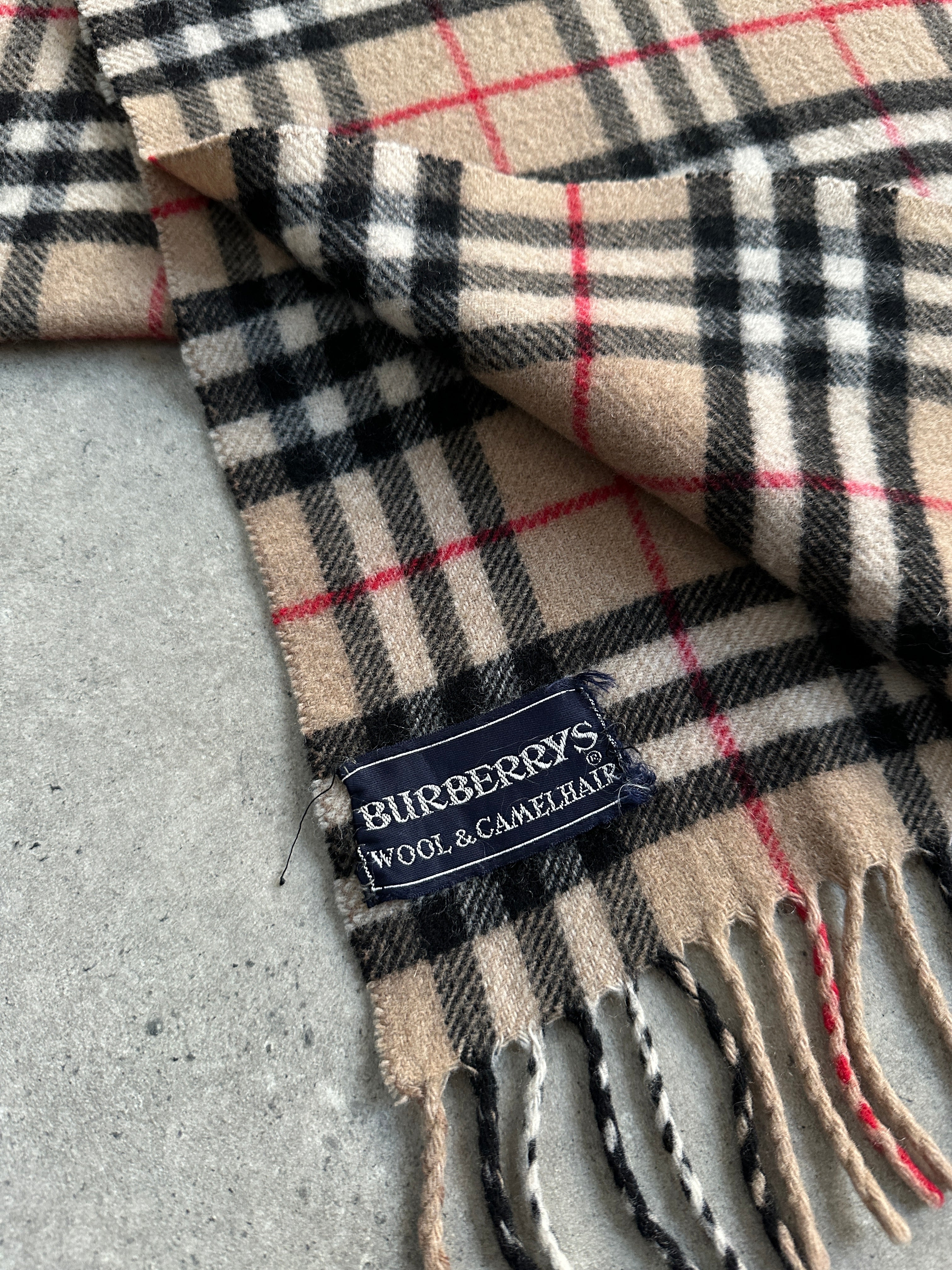 Burberry wool and camel hair Nova Check scarf showcasing classic plaid pattern and soft, luxurious fabric.