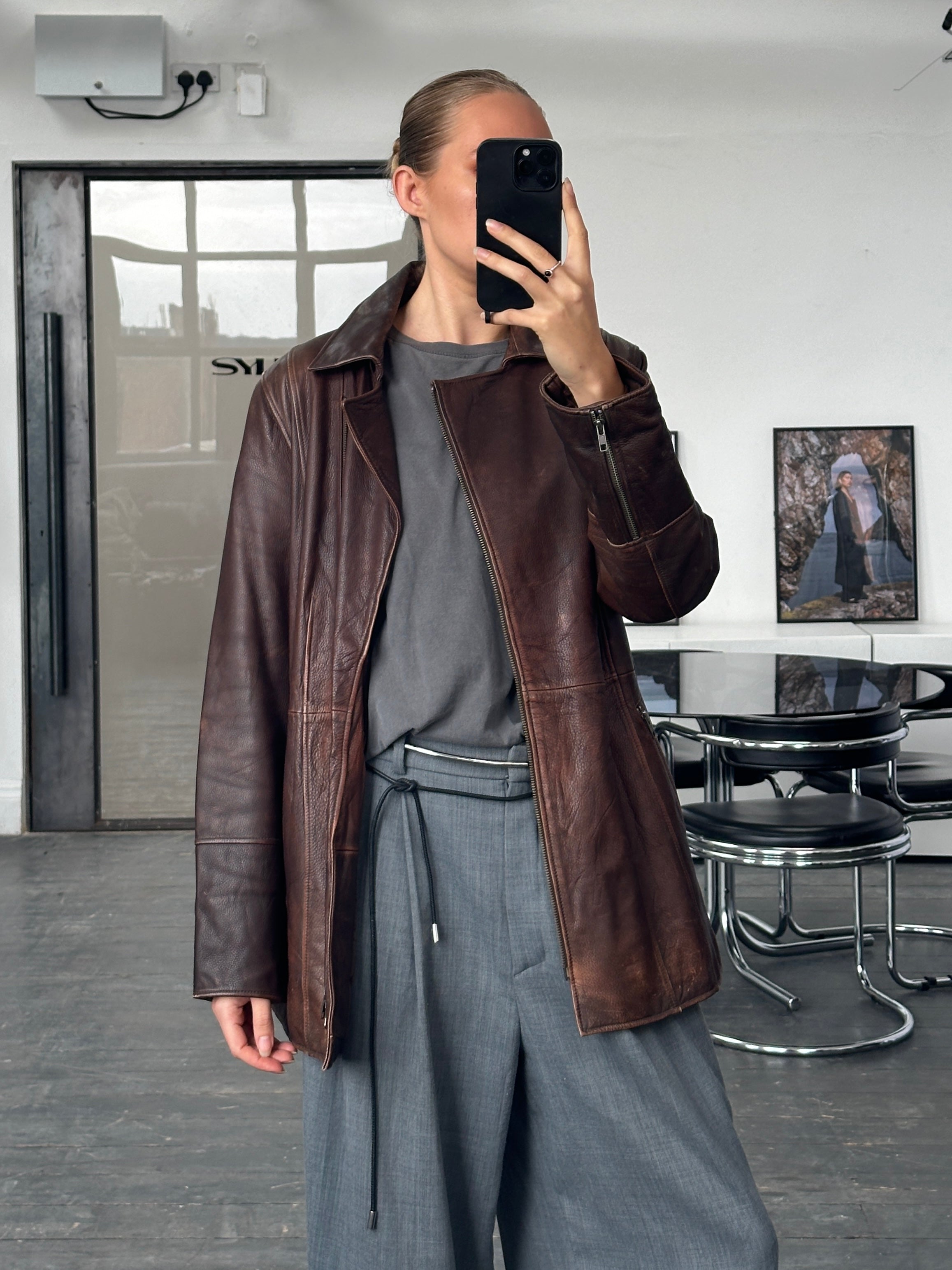 Vintage 1990s leather jacket with double zip and belt, aged look, size large, stylish retro men's outerwear.