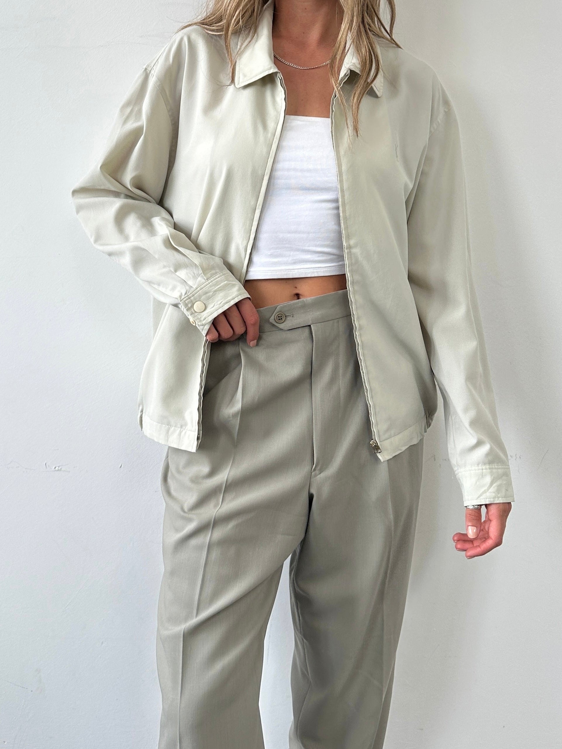 Yves Saint Laurent Pour Homme lightweight logo bomber jacket in M/L displayed on a hanger with visible brand logo and sleek design.