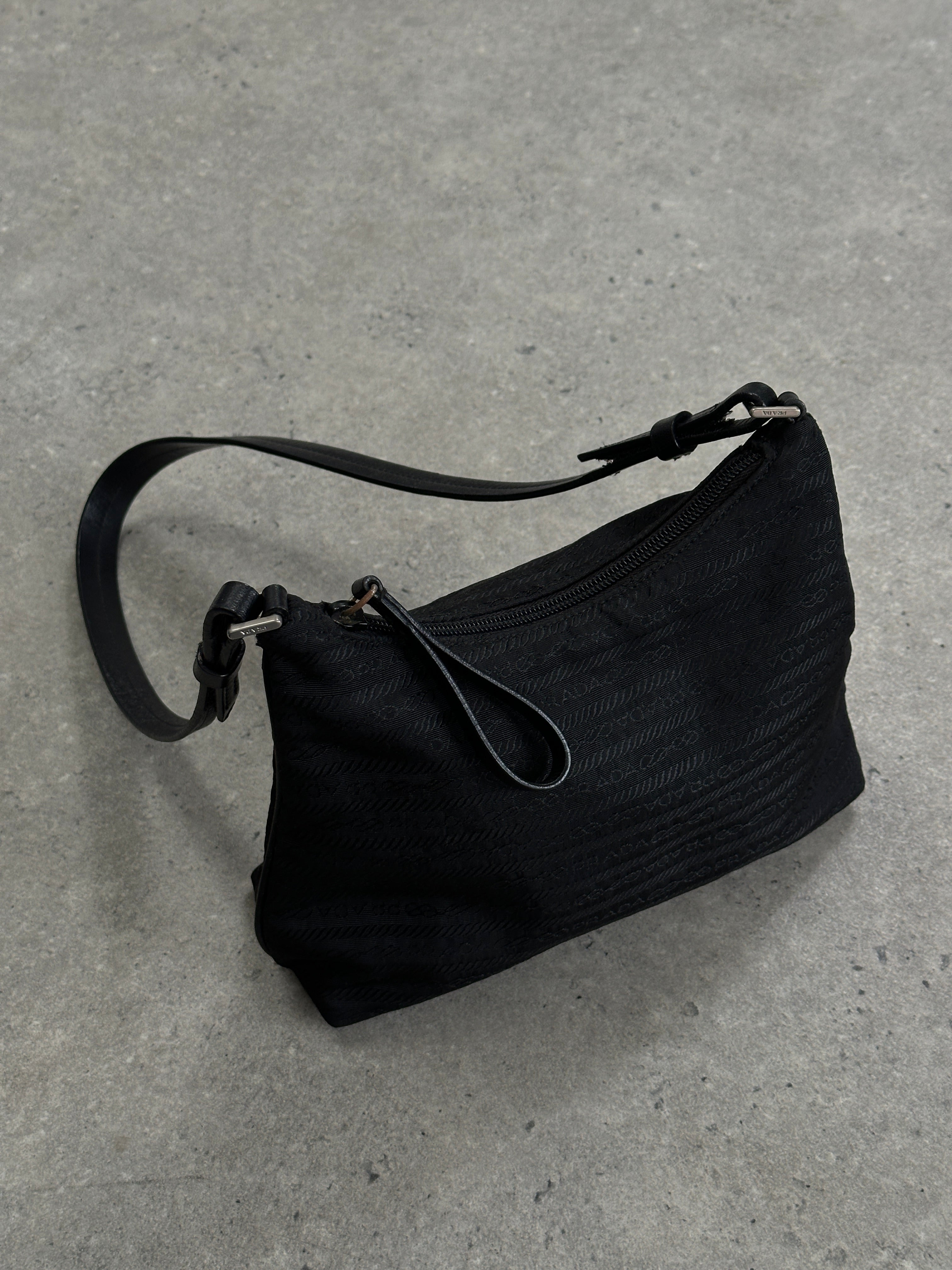 Prada nylon Tessuto Monogram crossbody bag with adjustable strap and signature logo, featuring a sleek, compact design.