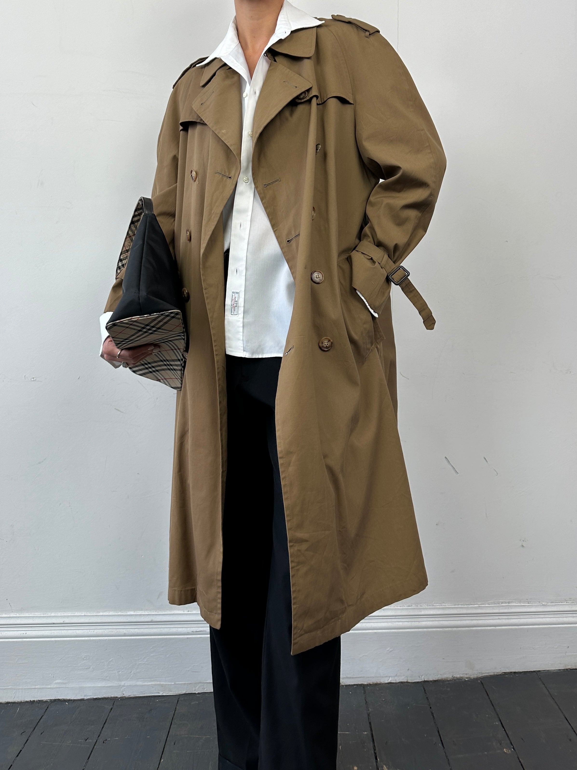 Christian Dior cotton double-breasted trench coat in size L, featuring classic design and stylish belt detail.
