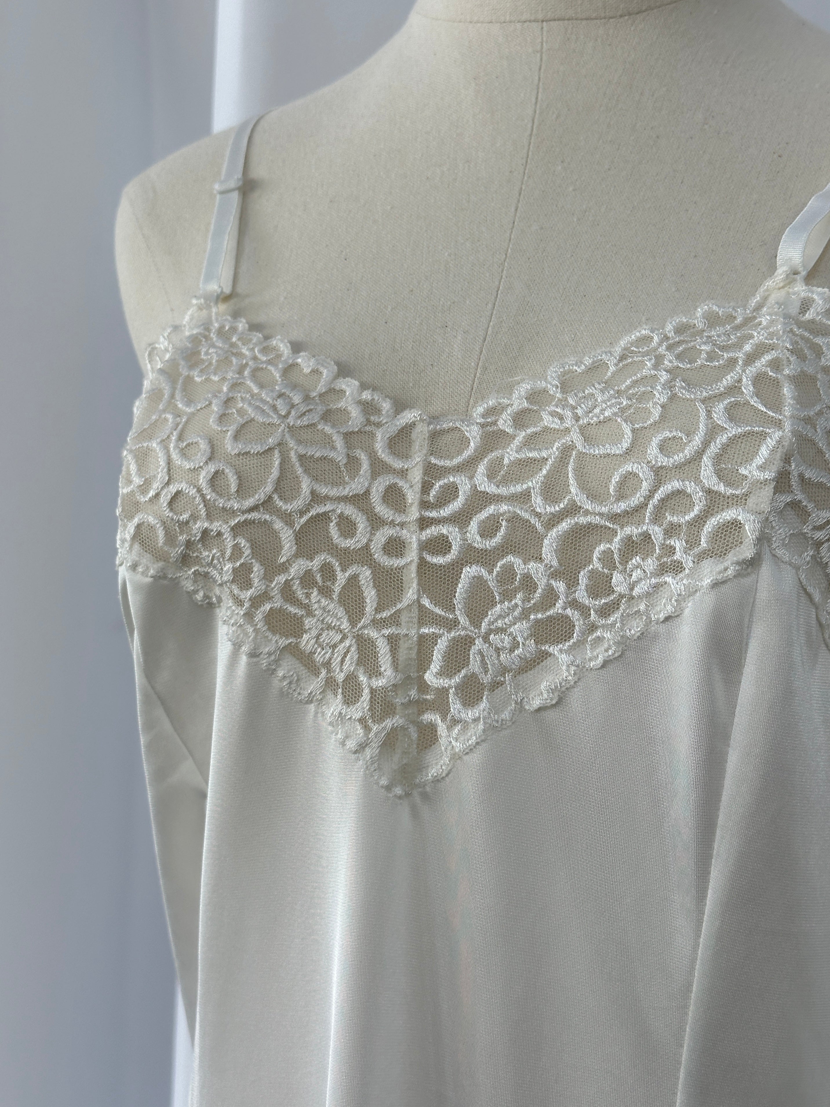 Vintage Japanese 1990s lace sheer mini slip dress, size S, featuring delicate floral lace and lightweight sheer fabric.