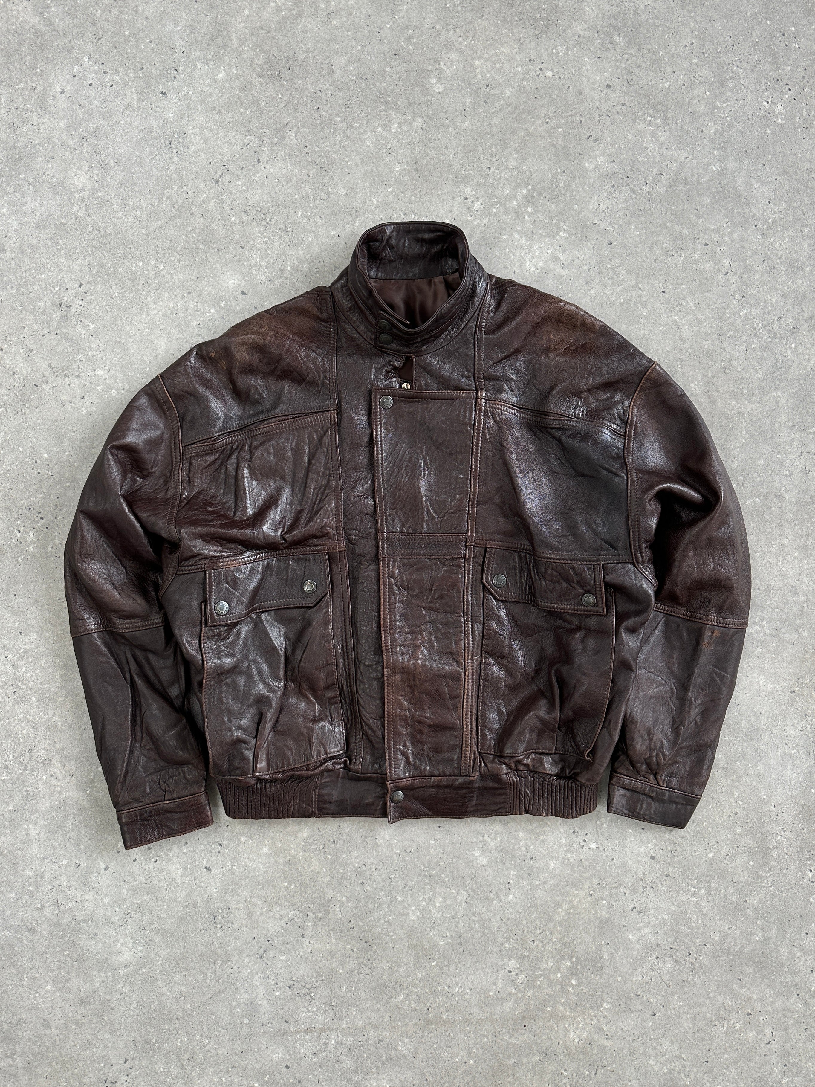 Vintage 1970s high neck moto leather bomber jacket in size XL, black leather with classic style and ribbed cuffs.
