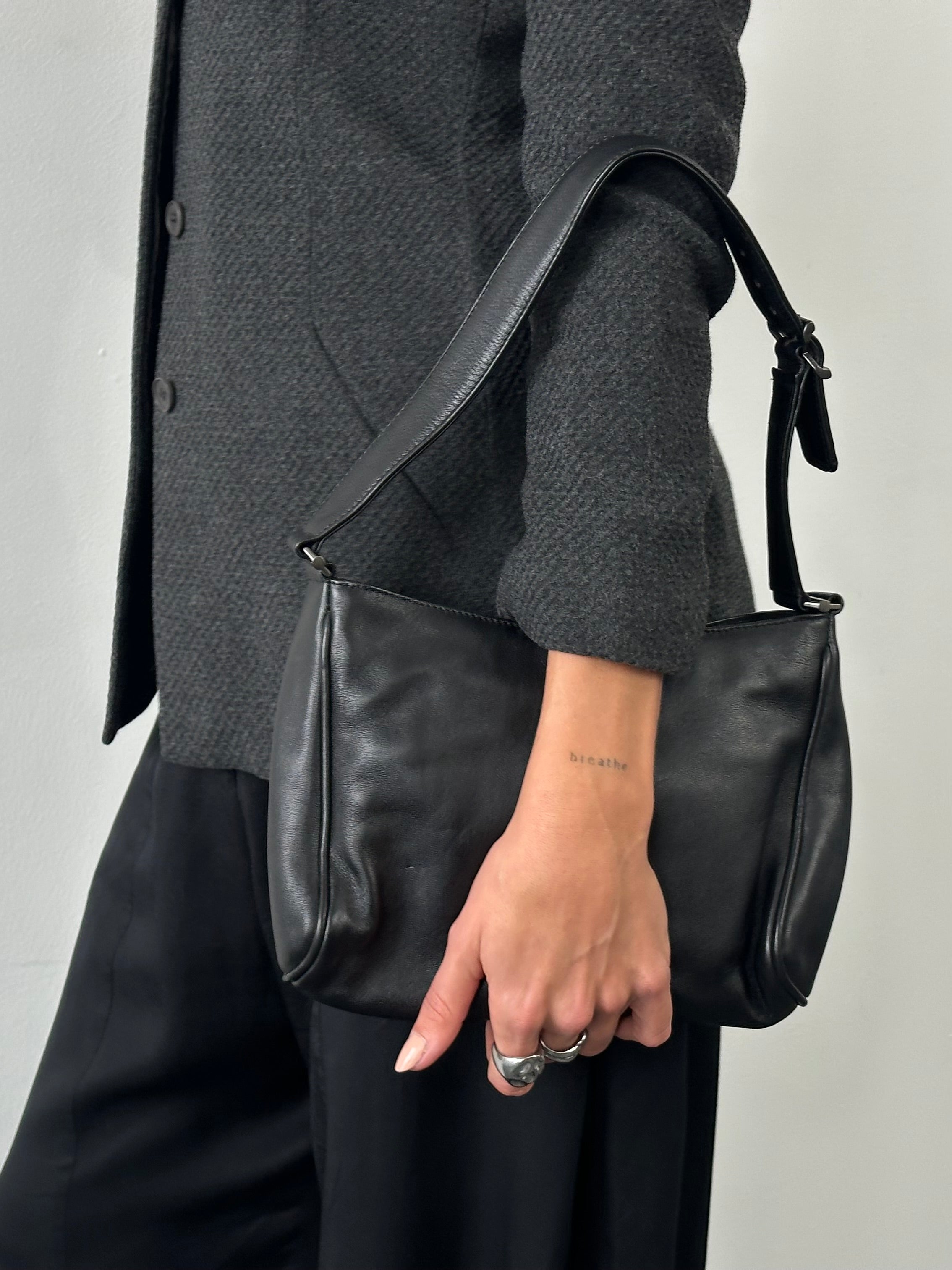 Giorgio Armani 2000s leather shoulder bag with sleek design and structured silhouette, featuring a top handle and subtle branding.