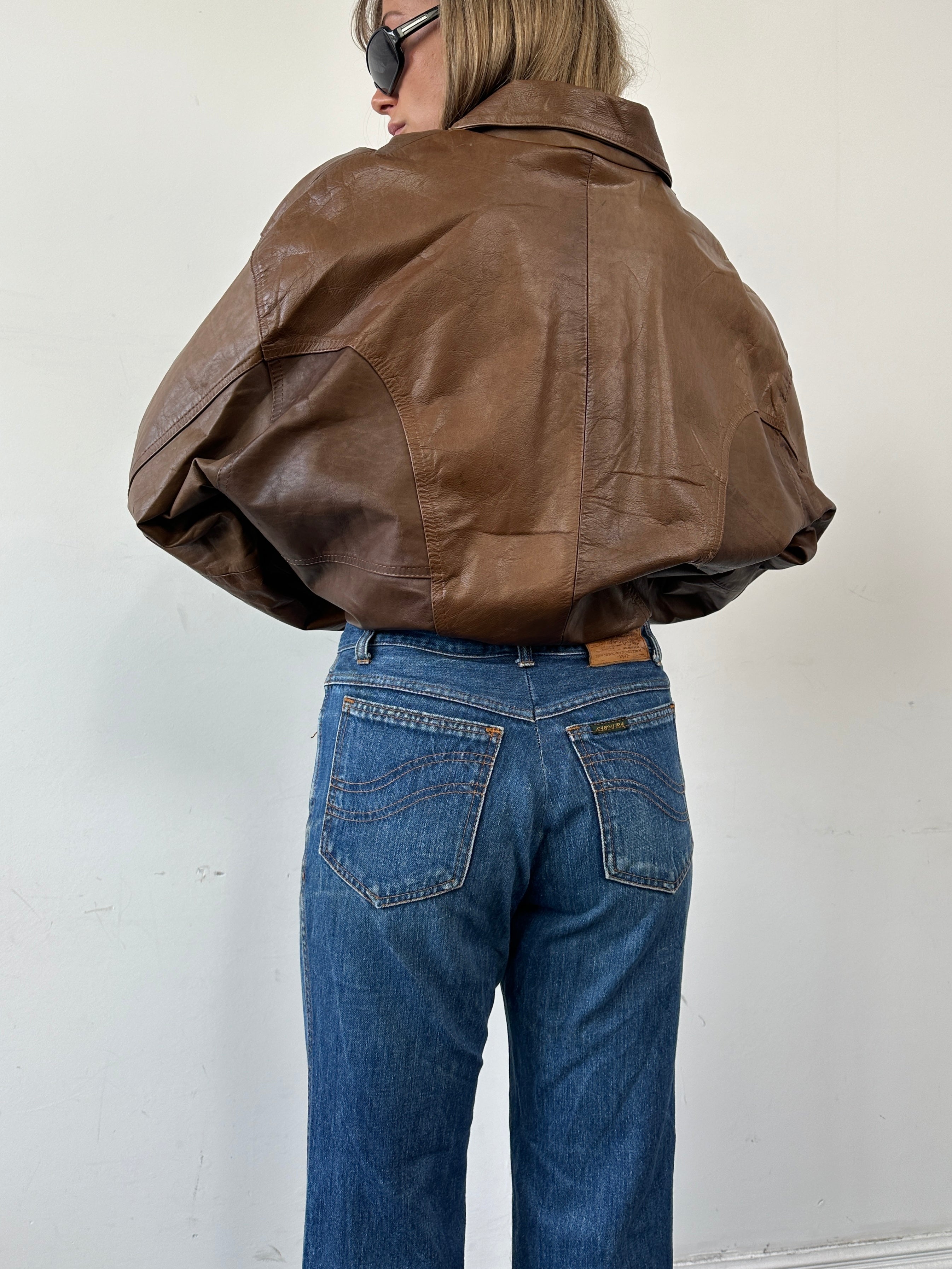 Carrera Italian straight leg denim jeans in W30, showcasing classic blue denim with a fitted waist and straight-leg cut.