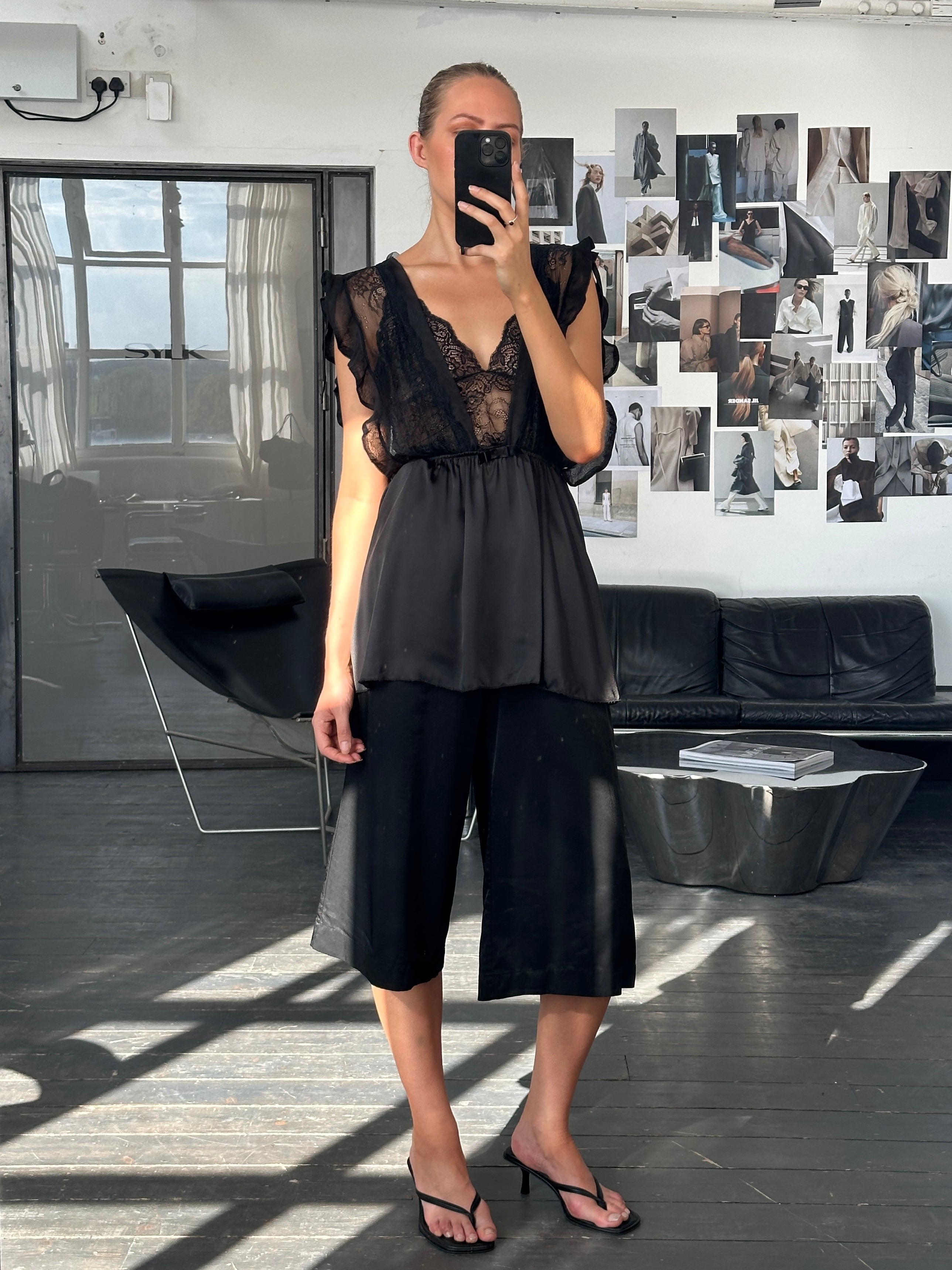 Vintage 2000s lace sheer satin babydoll top in size medium, featuring delicate lace details and flowing satin fabric.