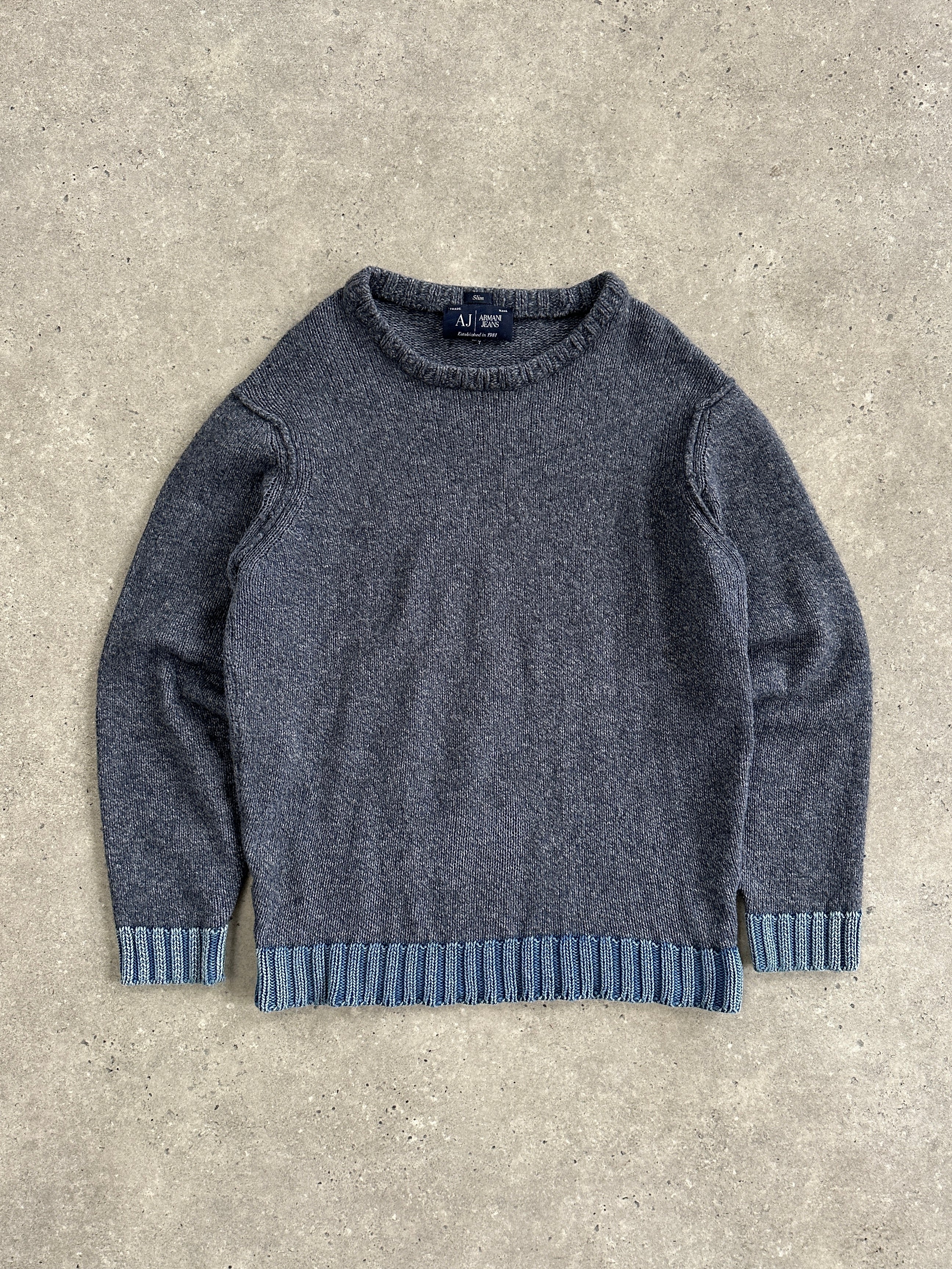 Armani Jeans wool knitted jumper in size M/L, navy blue with ribbed cuffs and collar, displayed on a hanger.