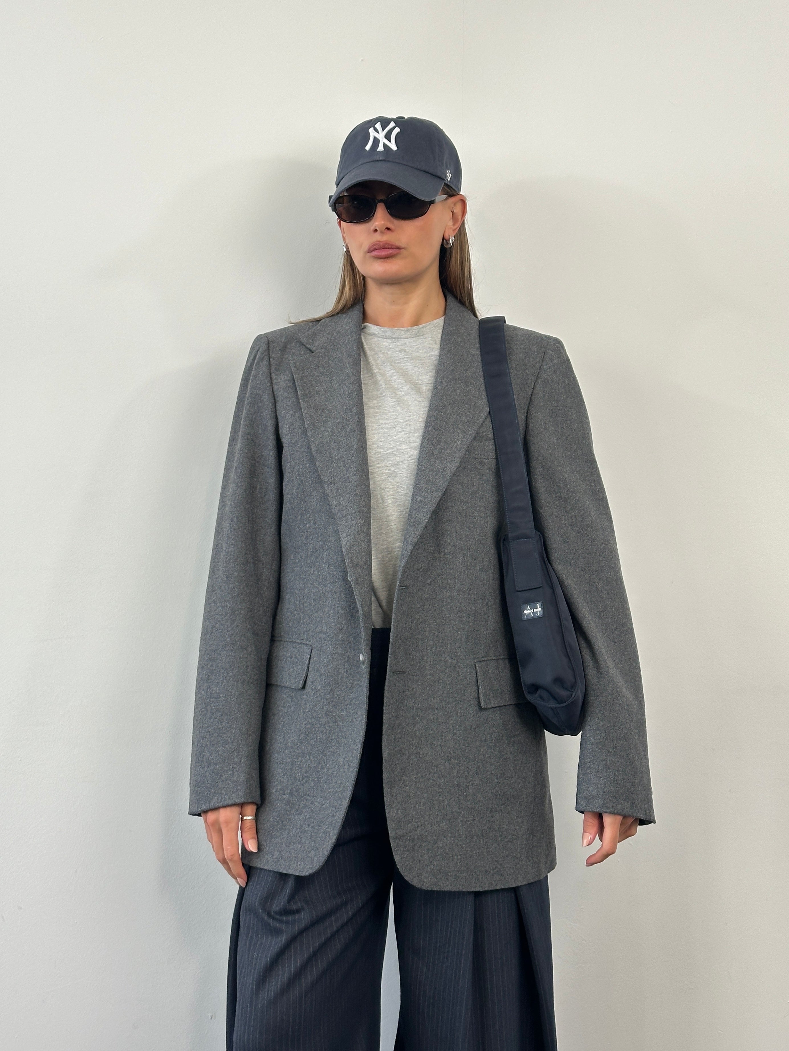 Yves Saint Laurent 1990s single-breasted brushed wool blazer in size 38R/L, displayed on a hanger with a tailored fit.