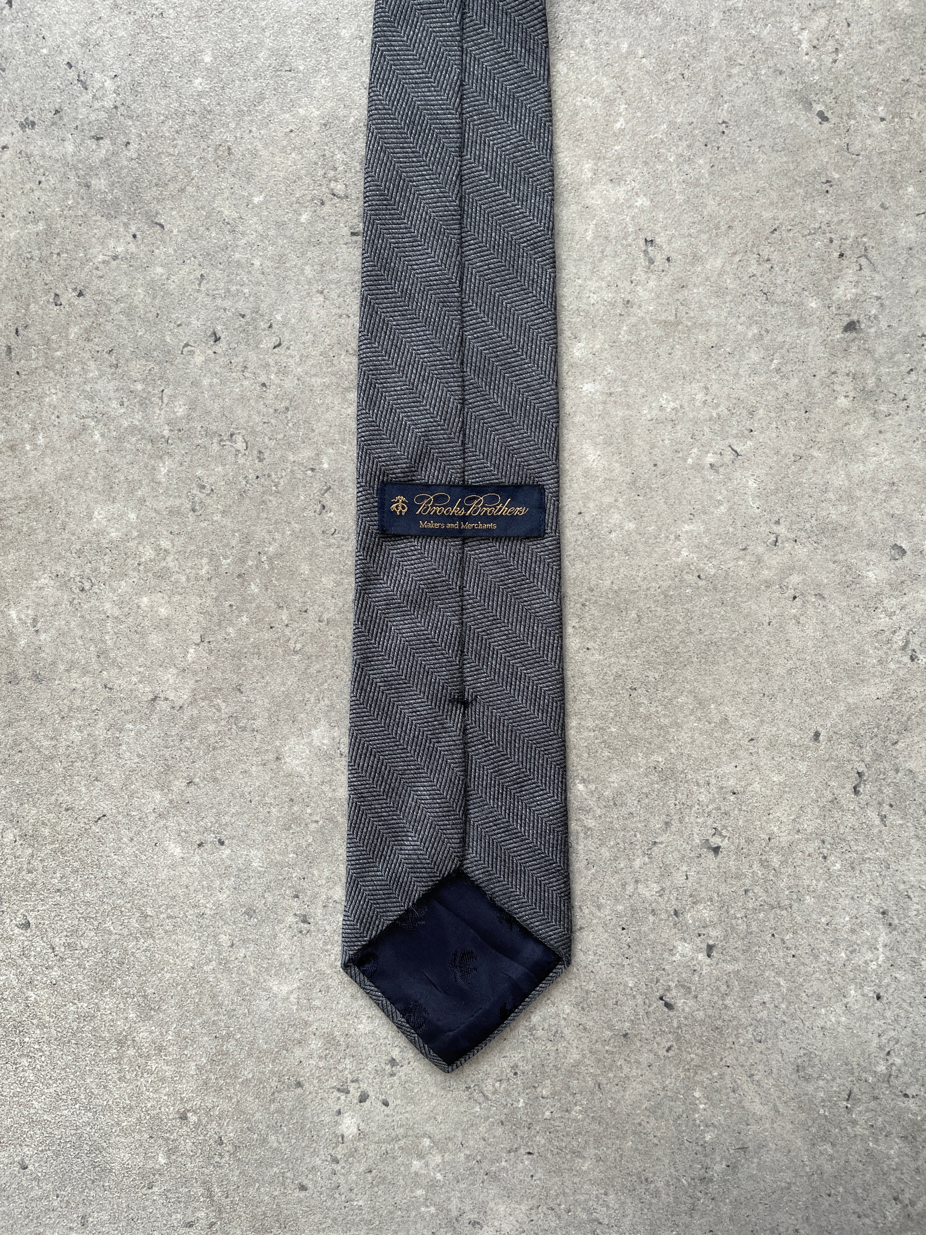 Brooks Brothers 1990s wool silk herringbone tie featuring a classic pattern and rich texture suitable for formal wear.