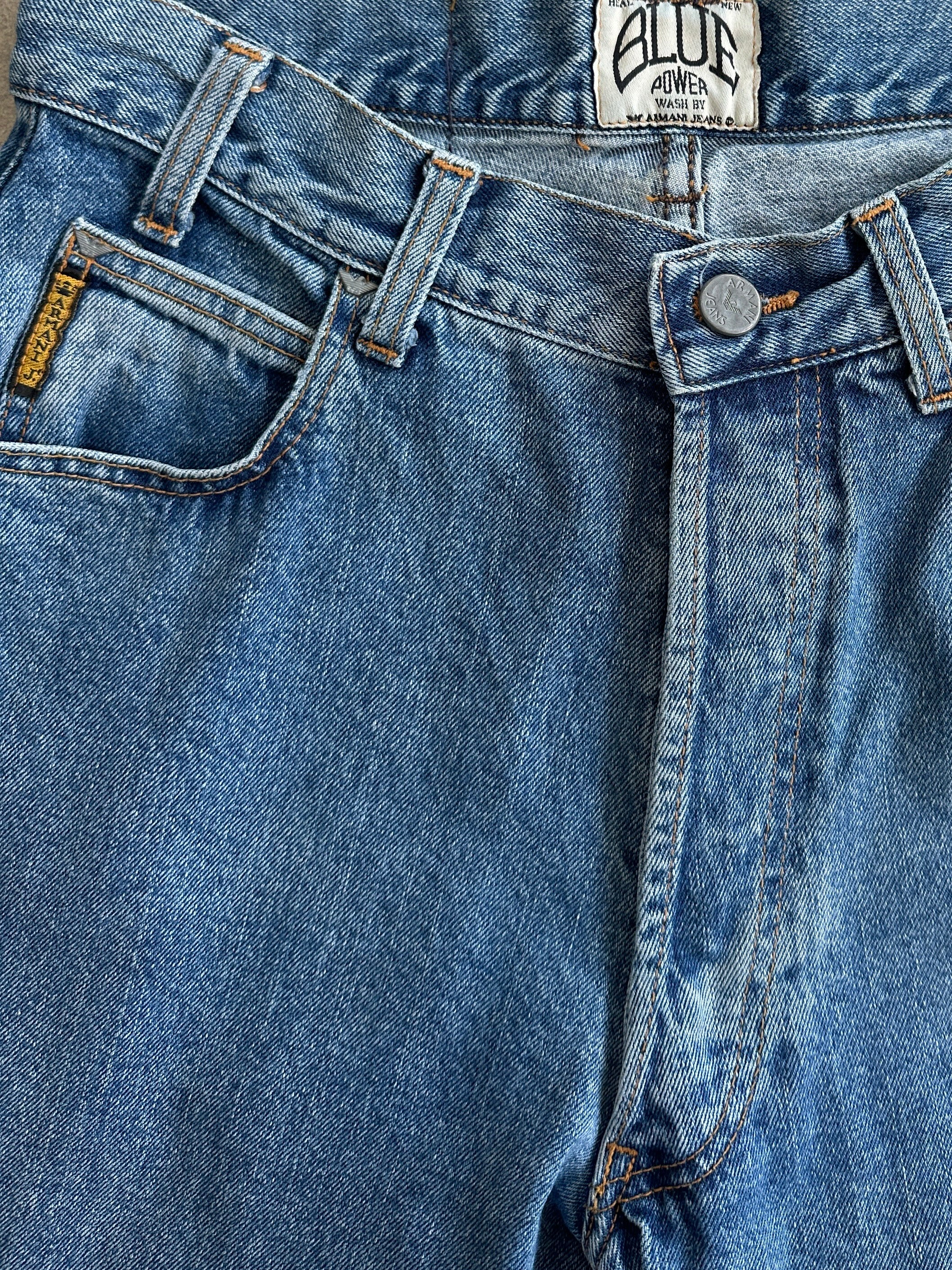 Armani Jeans mid wash tapered leg high-waisted denim jeans, size W28, showing front view with classic five-pocket design.
