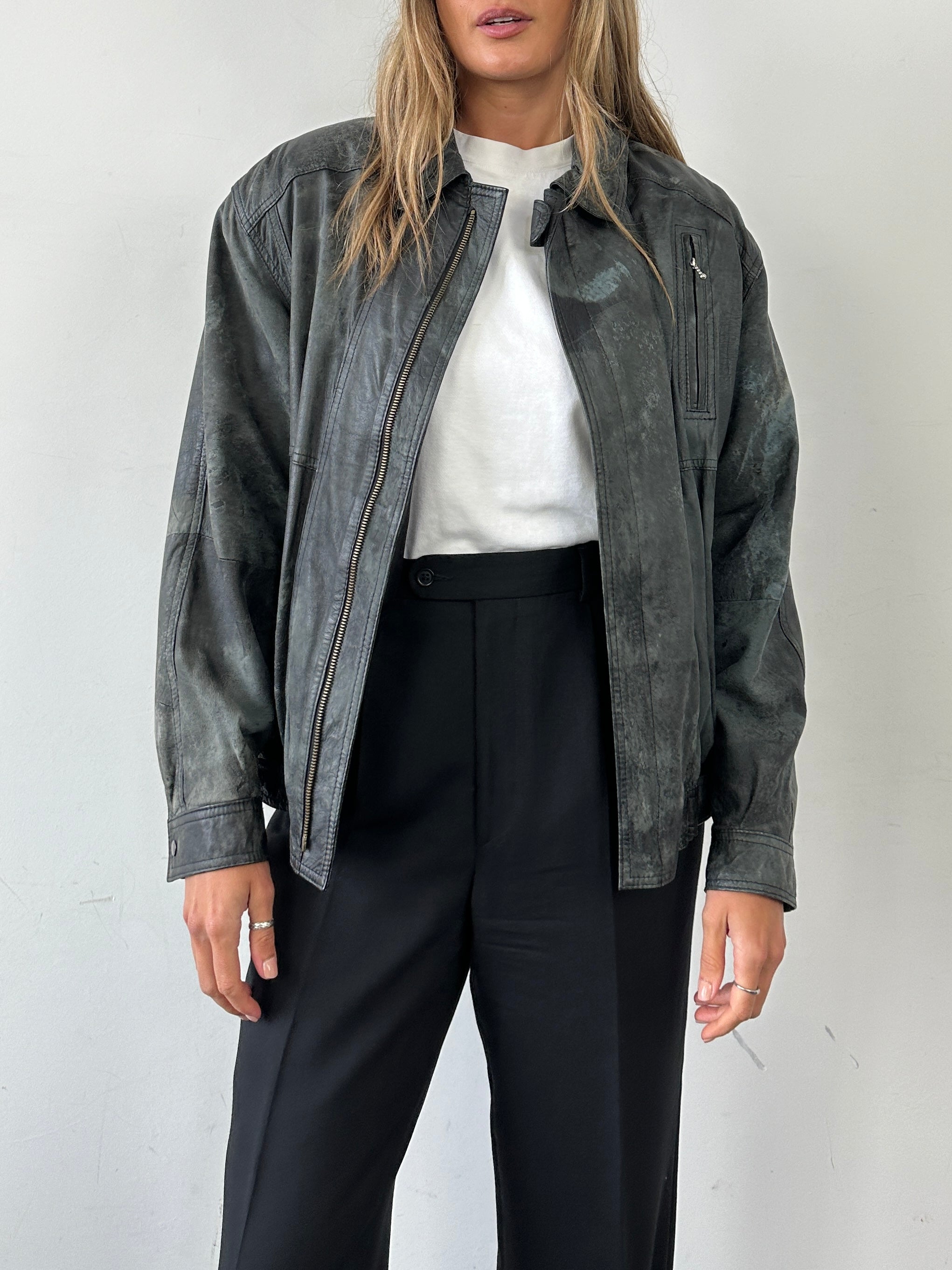 Vintage distressed marbled leather jacket, men's size M, featuring rugged texture and unique marbled design.