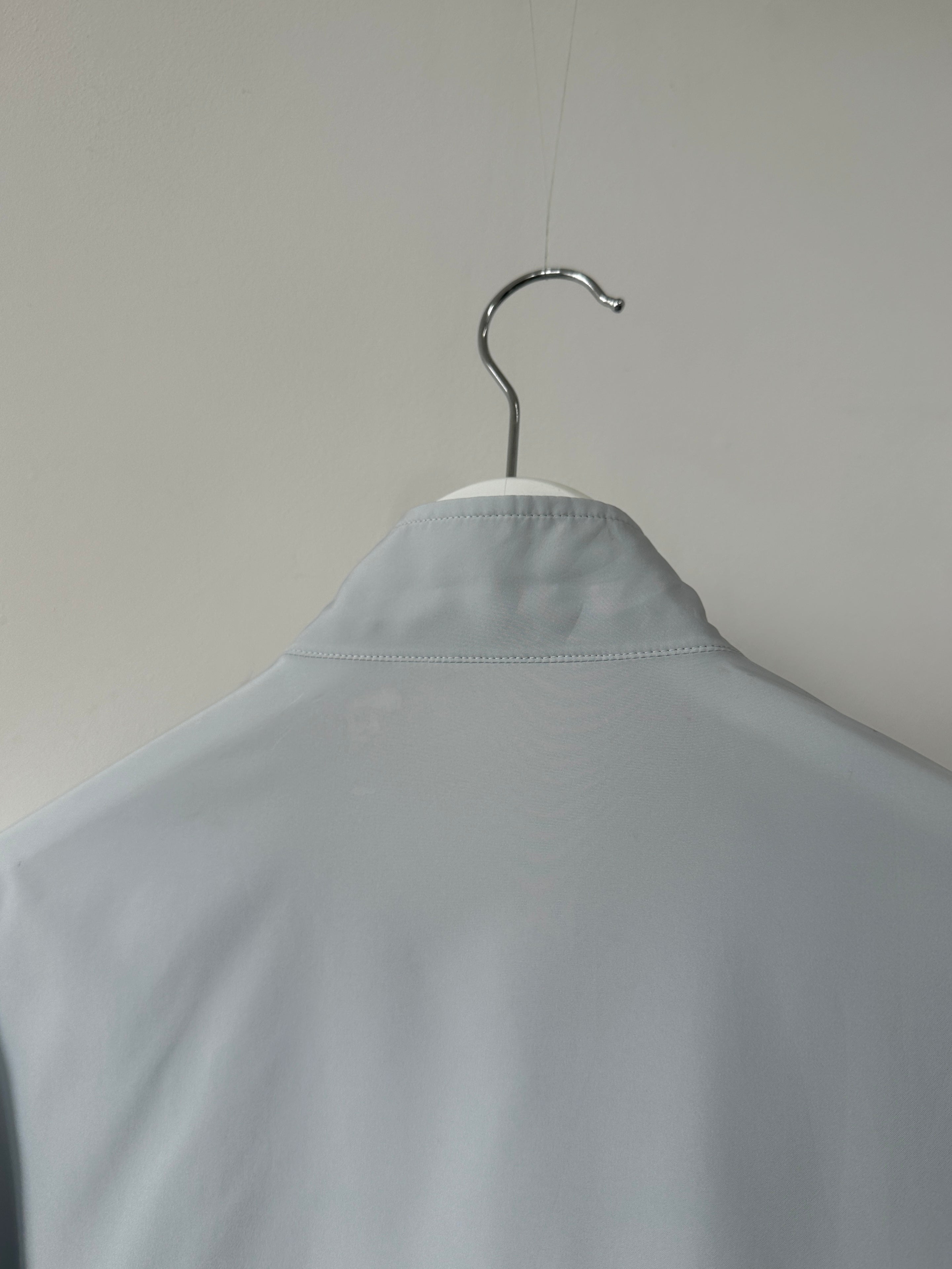 Yves Saint Laurent logo bomber jacket in size M, black with signature YSL branding, displayed on a hanger.