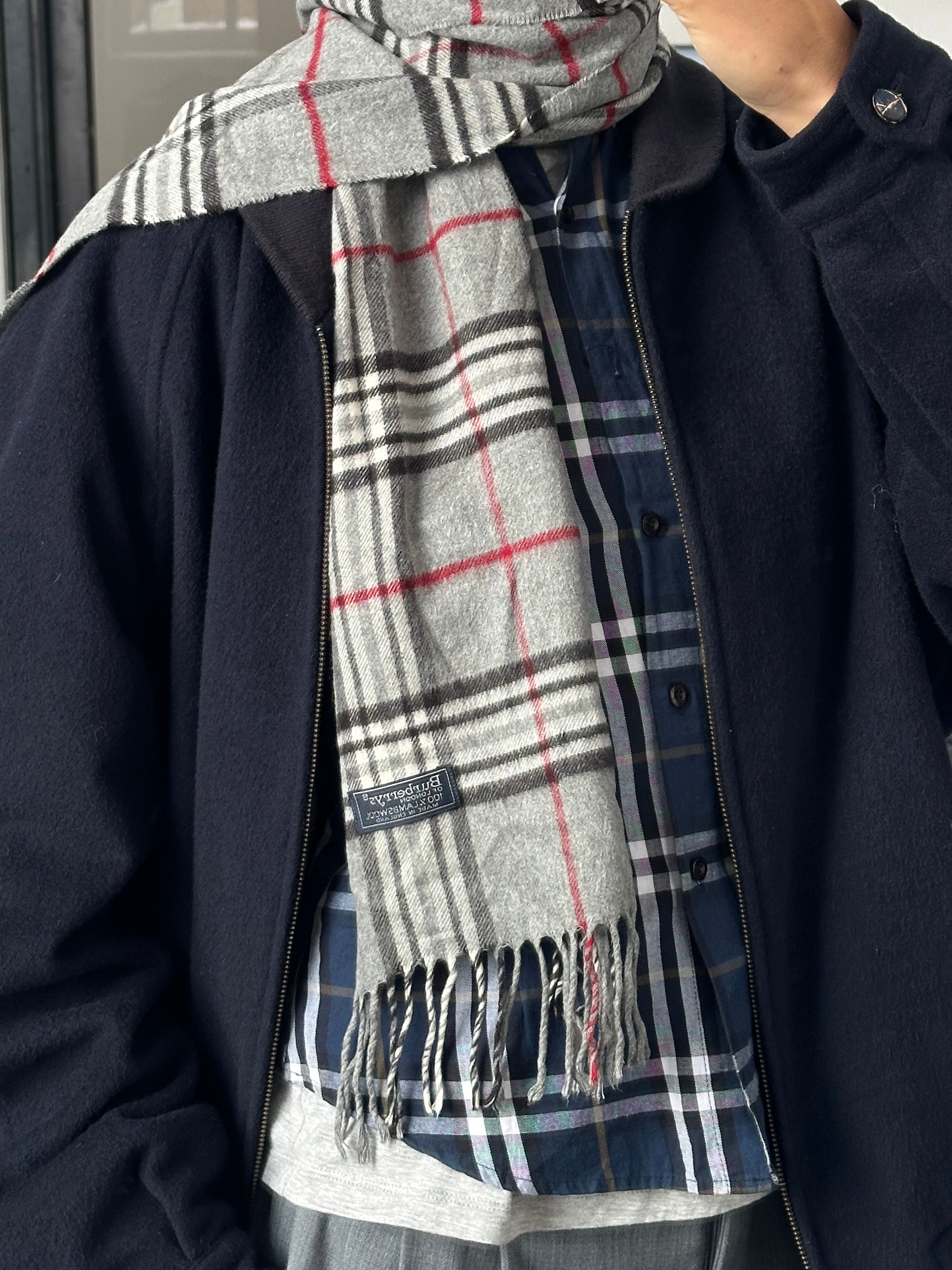 Burberry 1990s pure lambswool Nova Check scarf with classic plaid pattern and fringed edges, displayed flat.