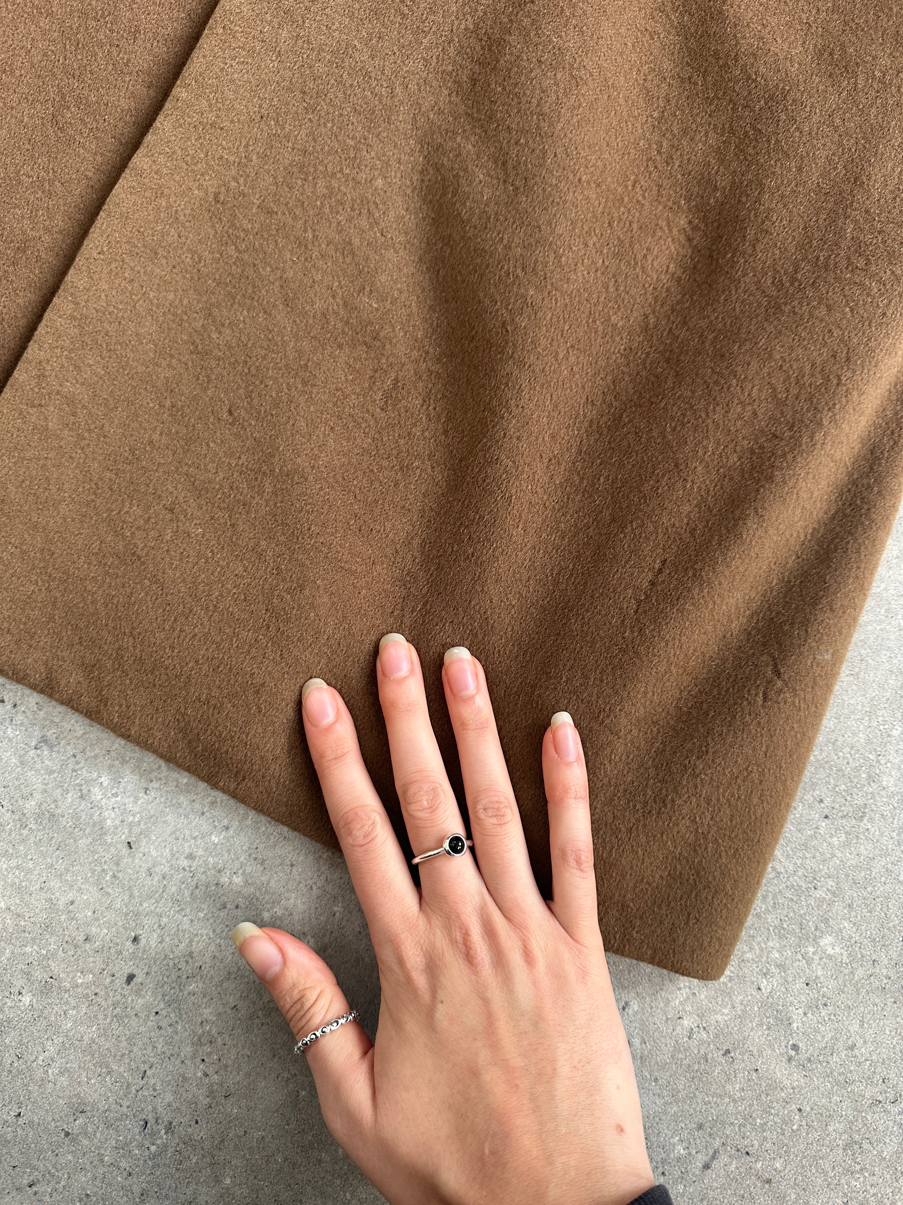 Vintage 1980s Italian pure cashmere coat in size S/M, showcasing classic design and luxurious texture.