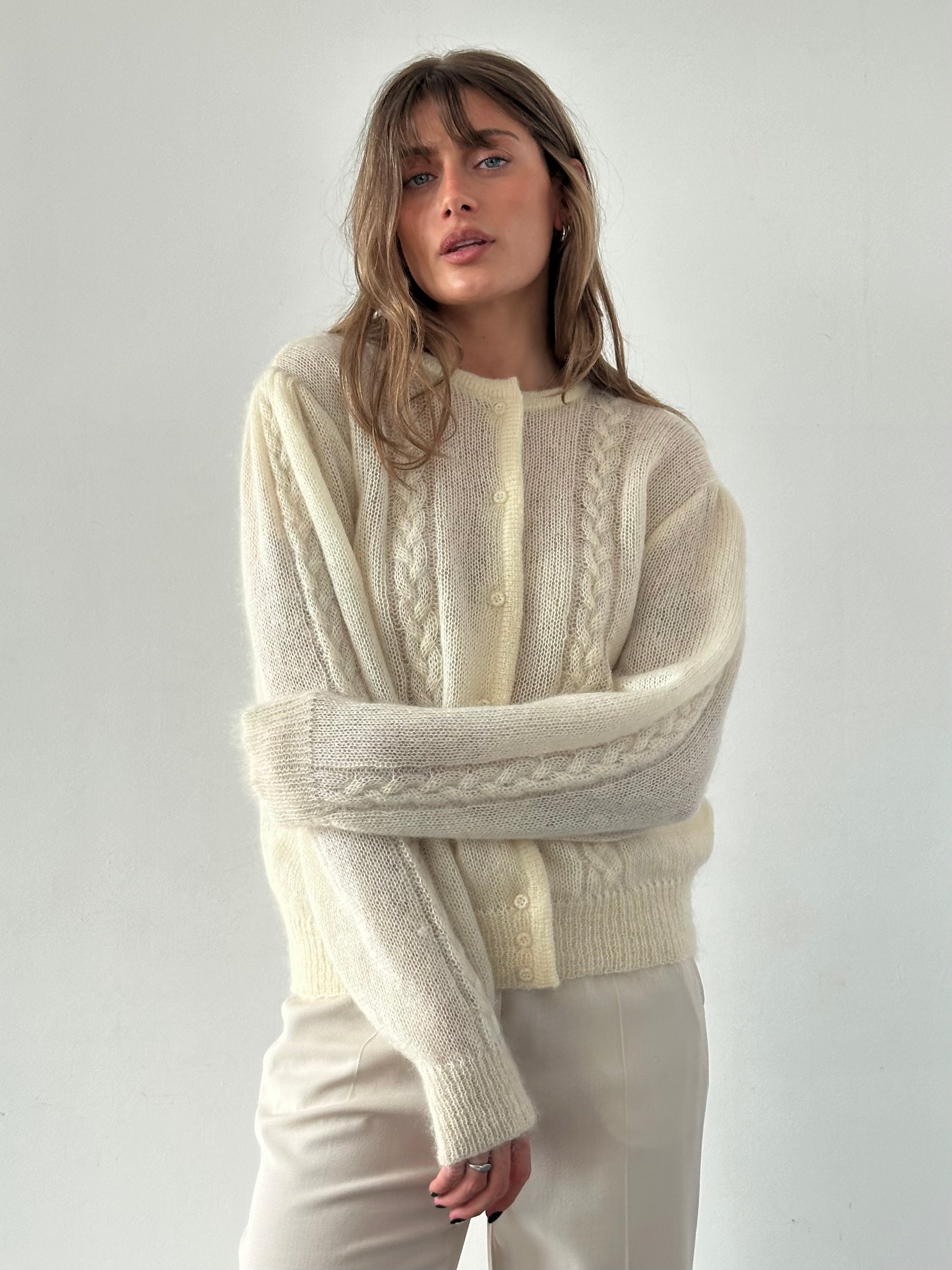 Vintage wool mohair cardigan in size L, featuring a cozy, textured knit with button-up front and ribbed cuffs.