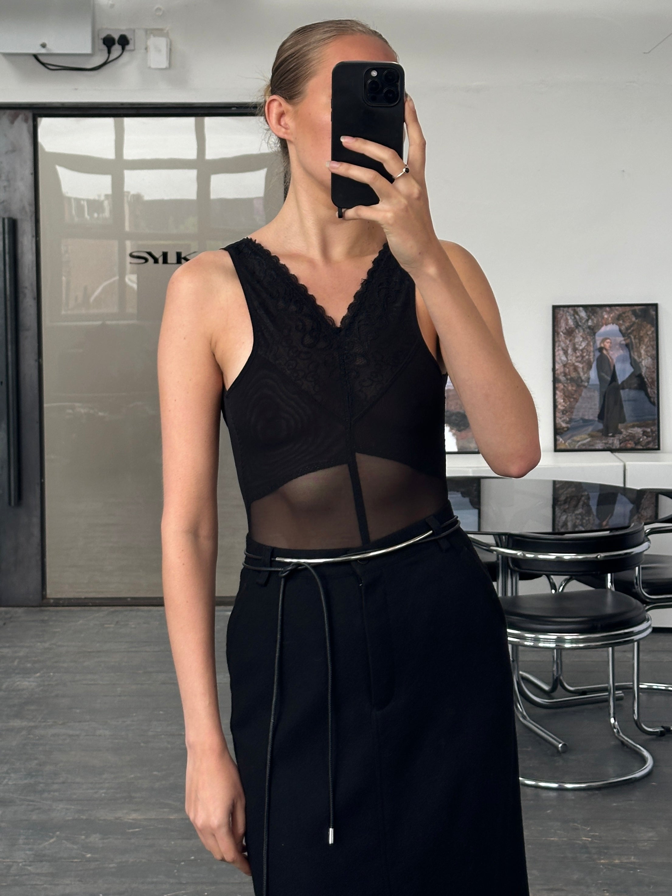 Vintage 2000s sheer lace bodysuit top in XS/S, featuring delicate lace fabric and a fitted silhouette.