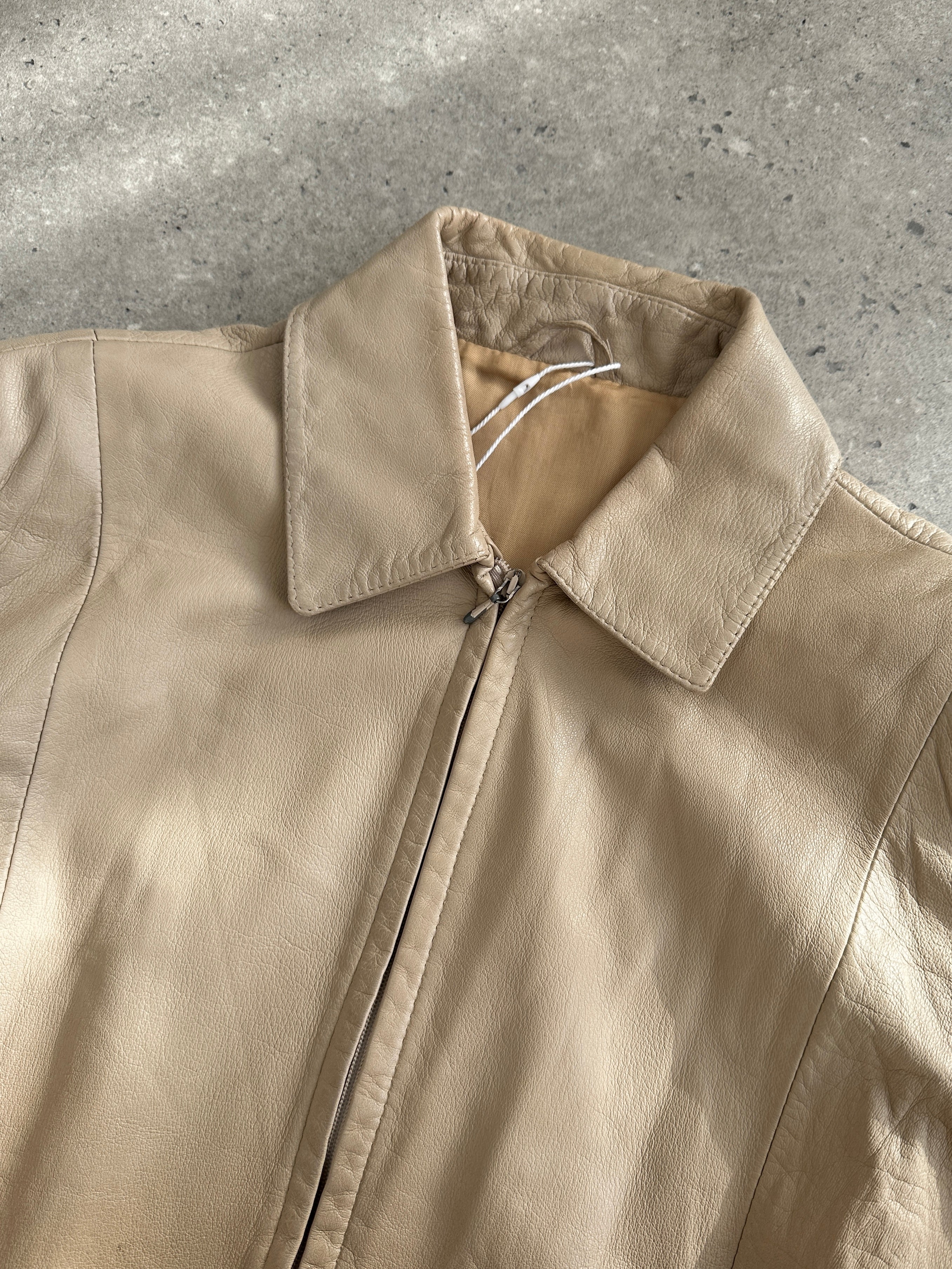Vintage Italian double zip leather jacket in classic brown, featuring a stylish vintage design and double zipper closure.