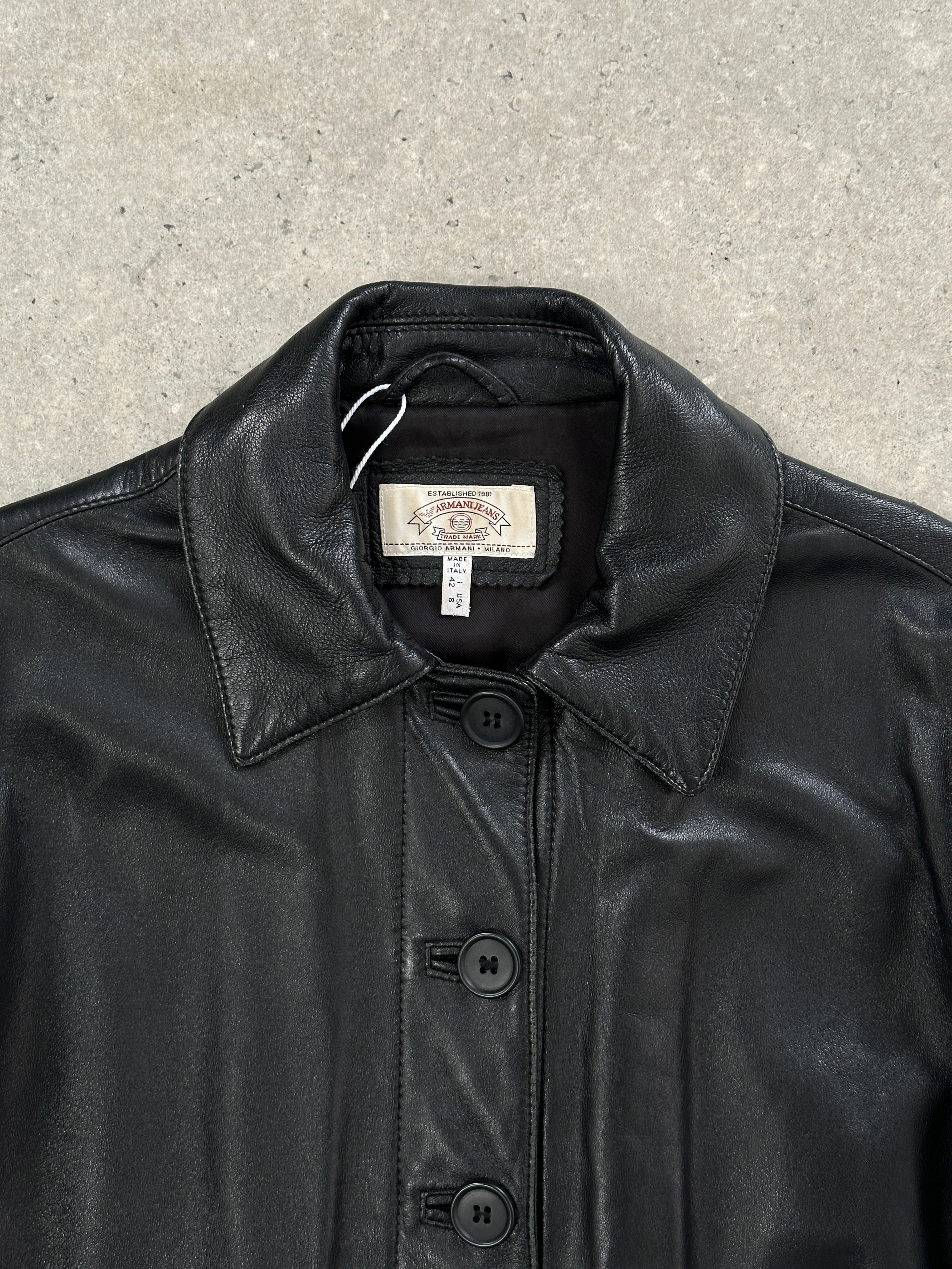 Armani Jeans leather jacket with button-up front, black leather, slim fit, and stylish design, size small.