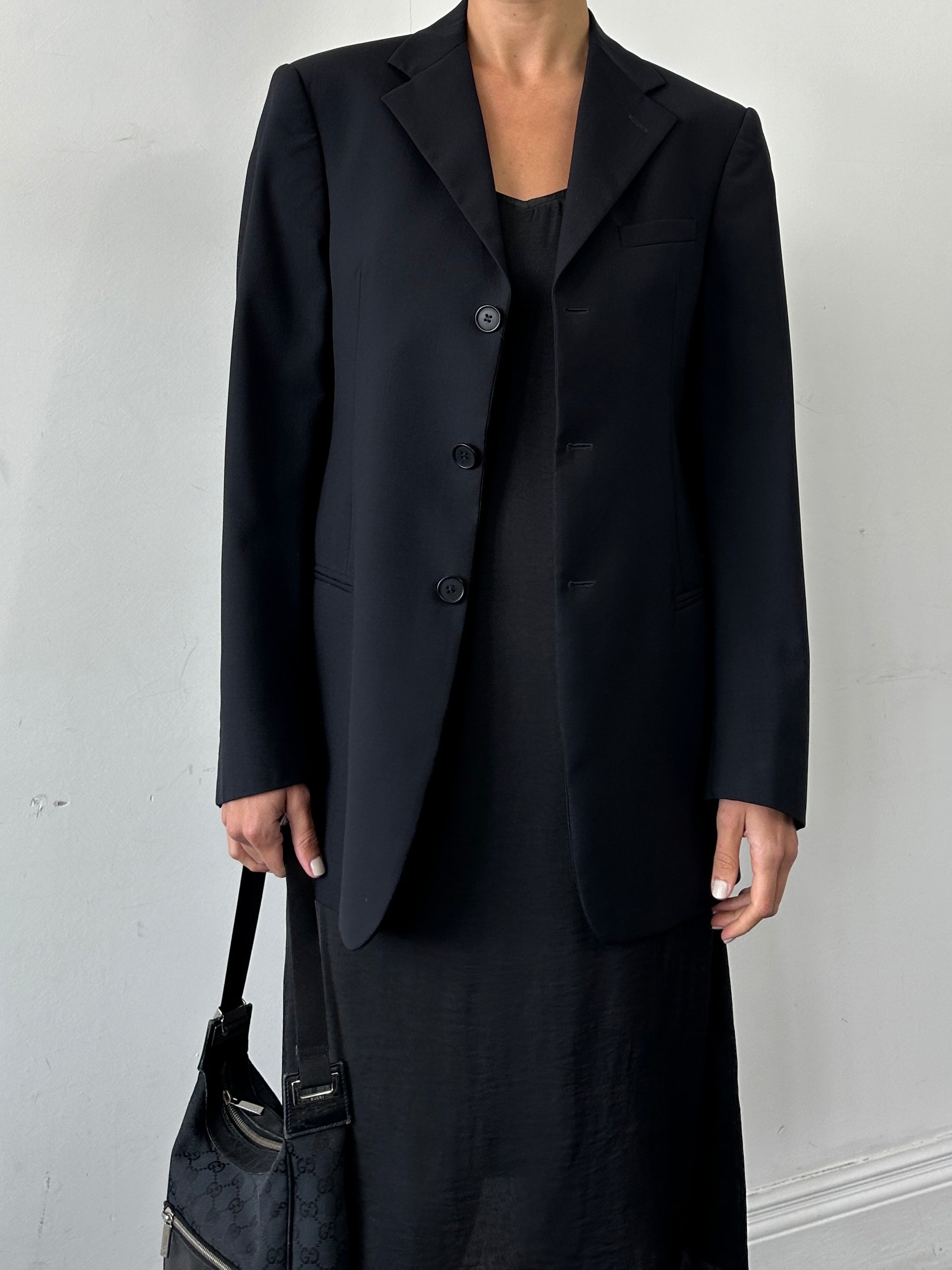 Emporio Armani wool single-breasted blazer in size 38R/M, tailored fit, dark navy color, displayed on a hanger.