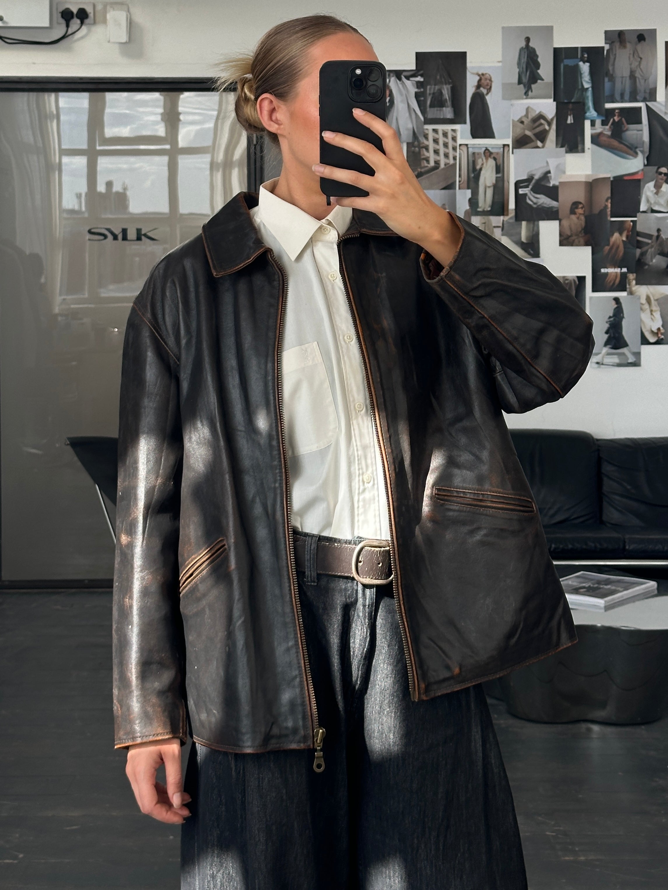 Vintage Italian 1990s distressed leather jacket, L/XL size, featuring rugged texture and classic design.