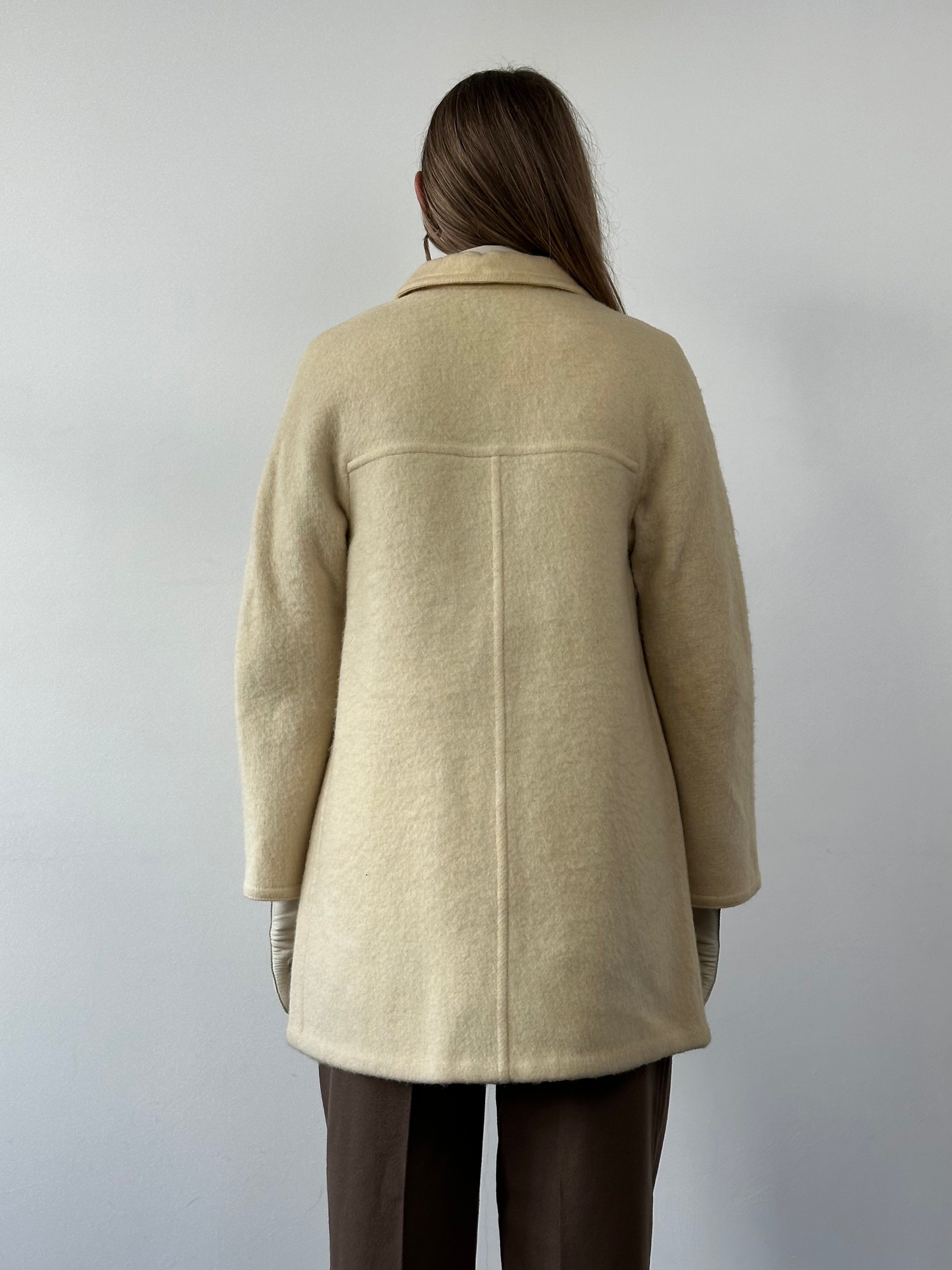 Marella 80s wool double-faced single-breasted coat in neutral tones, displayed on a hanger showcasing its classic tailored design.