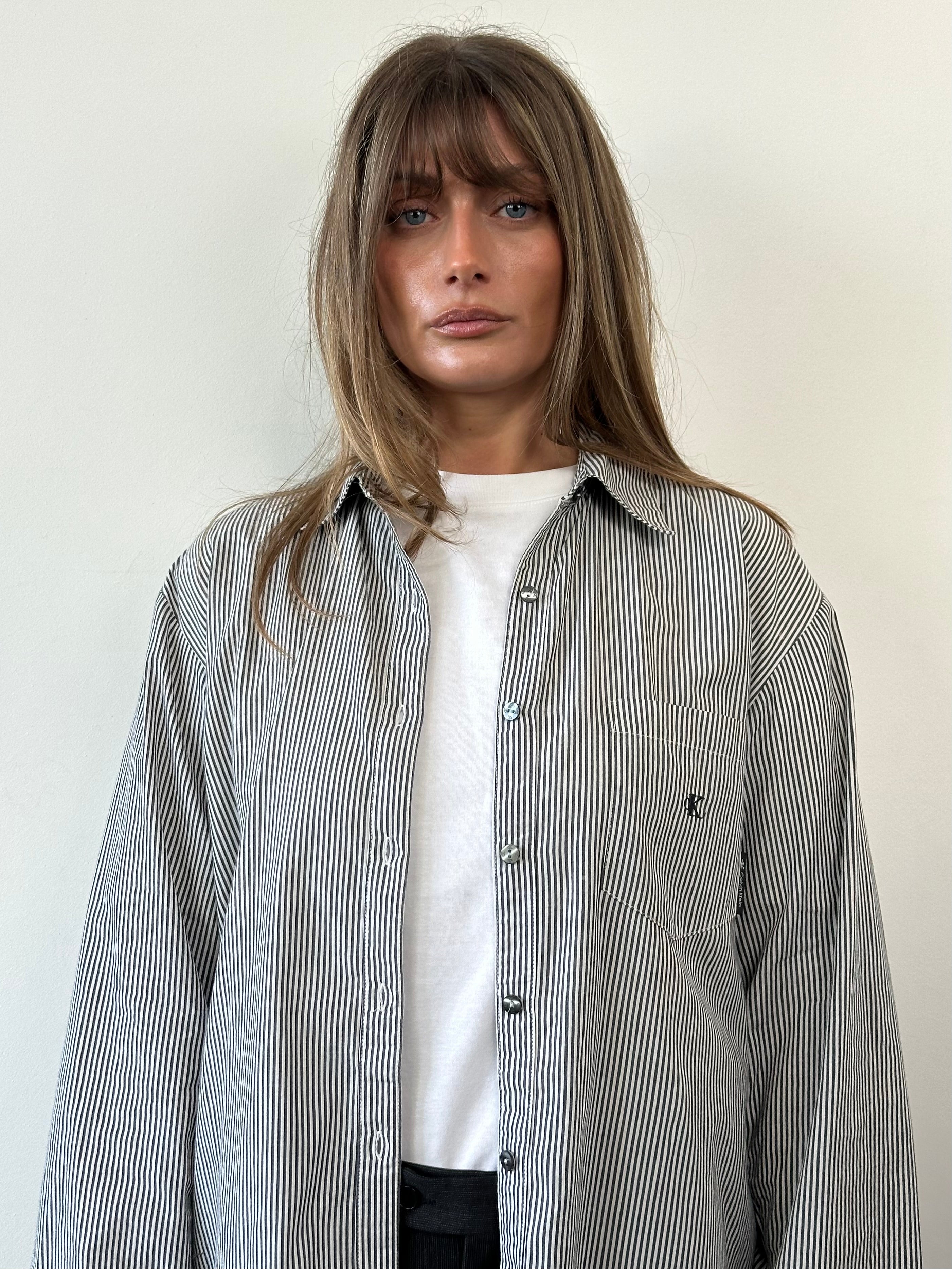 Calvin Klein pure cotton stripe logo shirt in XL, featuring a classic design with the brand's logo on the chest.