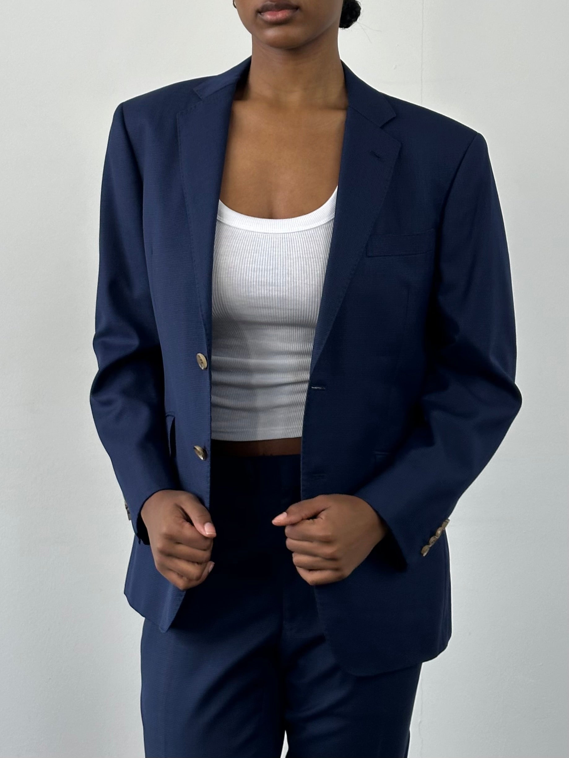 Loro Piana 2000s pure wool single-breasted suit in size 36S/W32, tailored fit, dark gray color, displayed on a hanger.