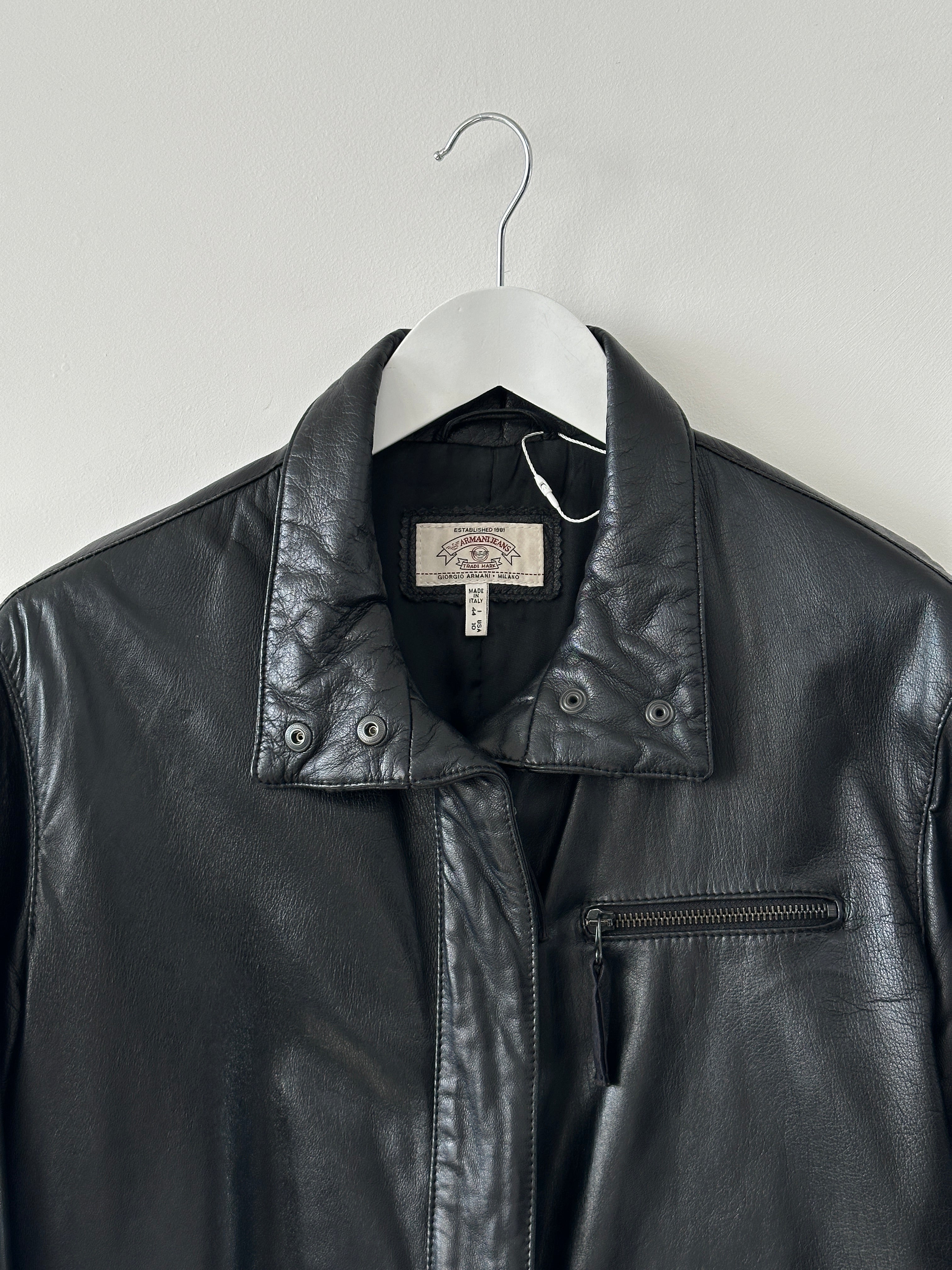 Armani Jeans black leather jacket with double zippers, stylish men's design, featuring a sleek collar and zip pockets.