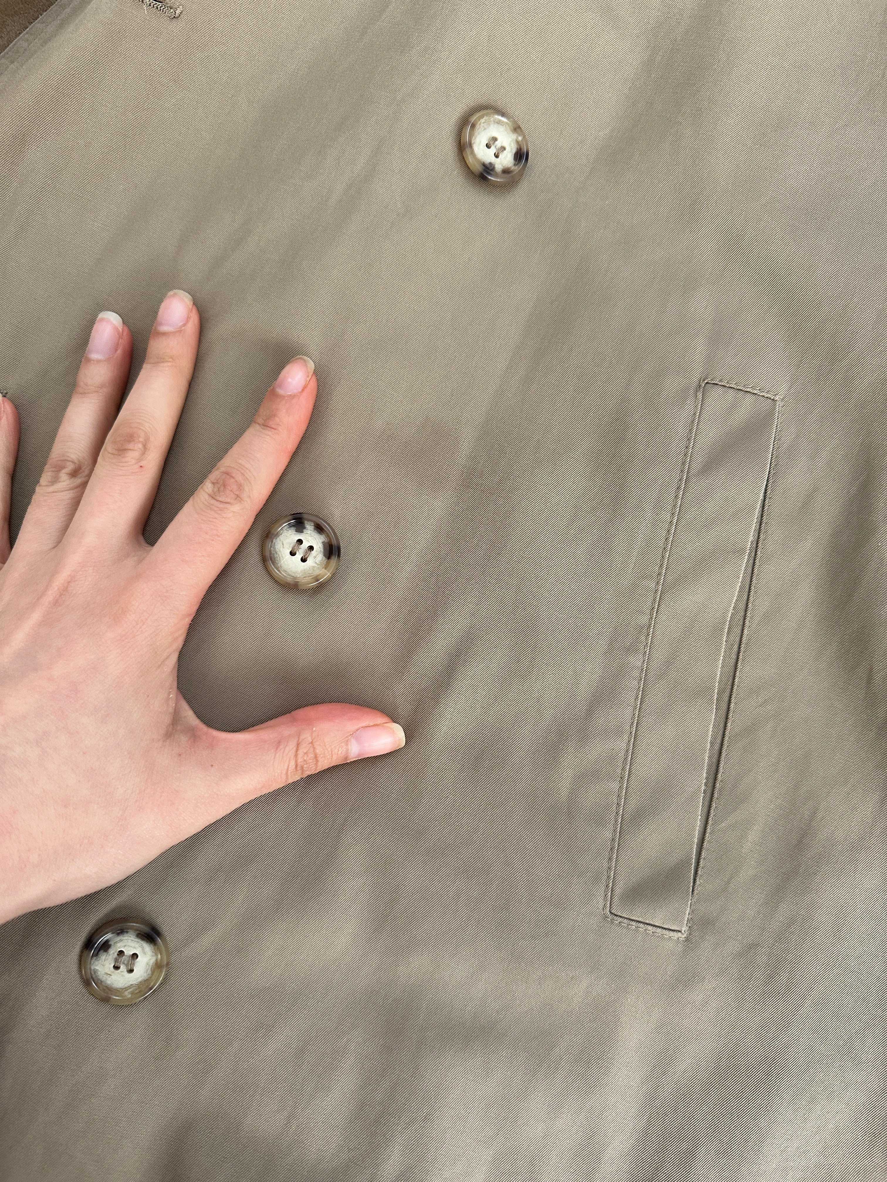 Yves Saint Laurent 80s pure cotton double-breasted belted trench coat in XL, showing beige color, collar, and button details.