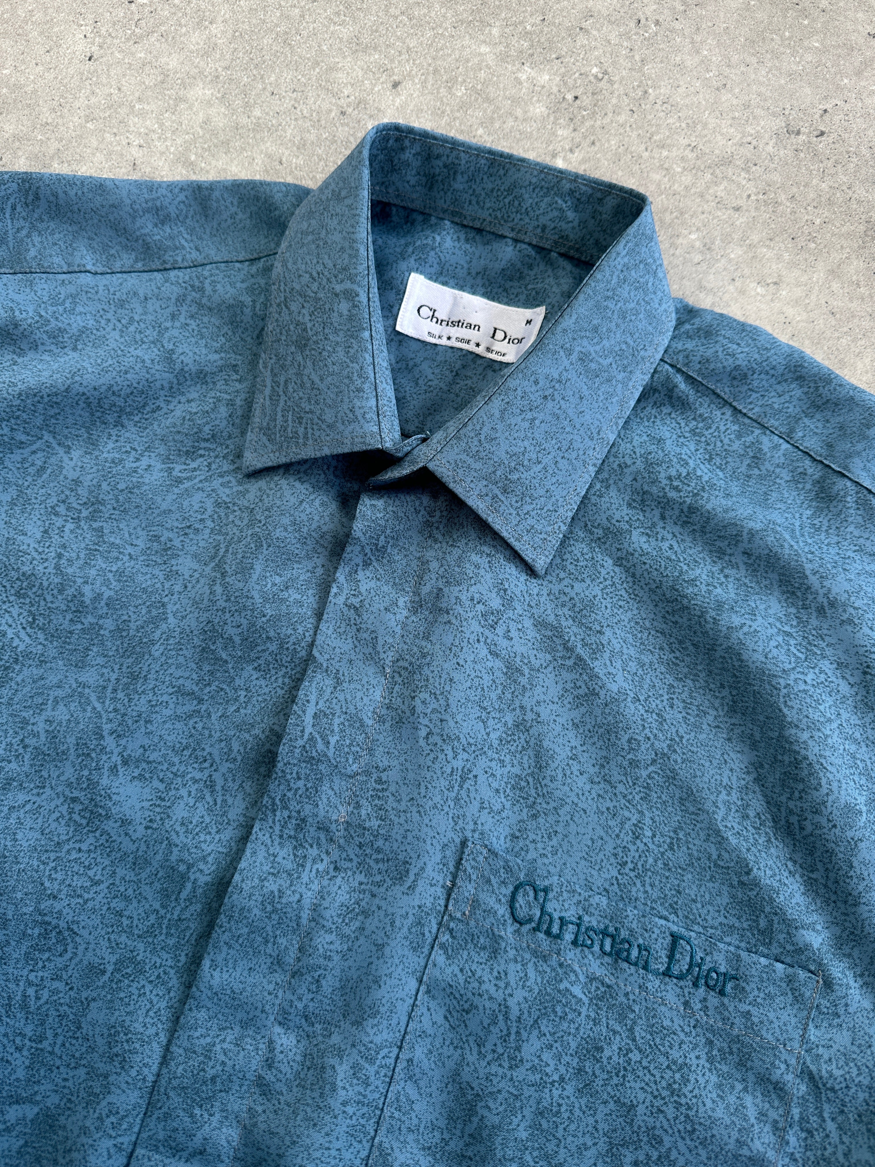Christian Dior silk print short sleeve logo shirt in size L, featuring a stylish design and classic fit.