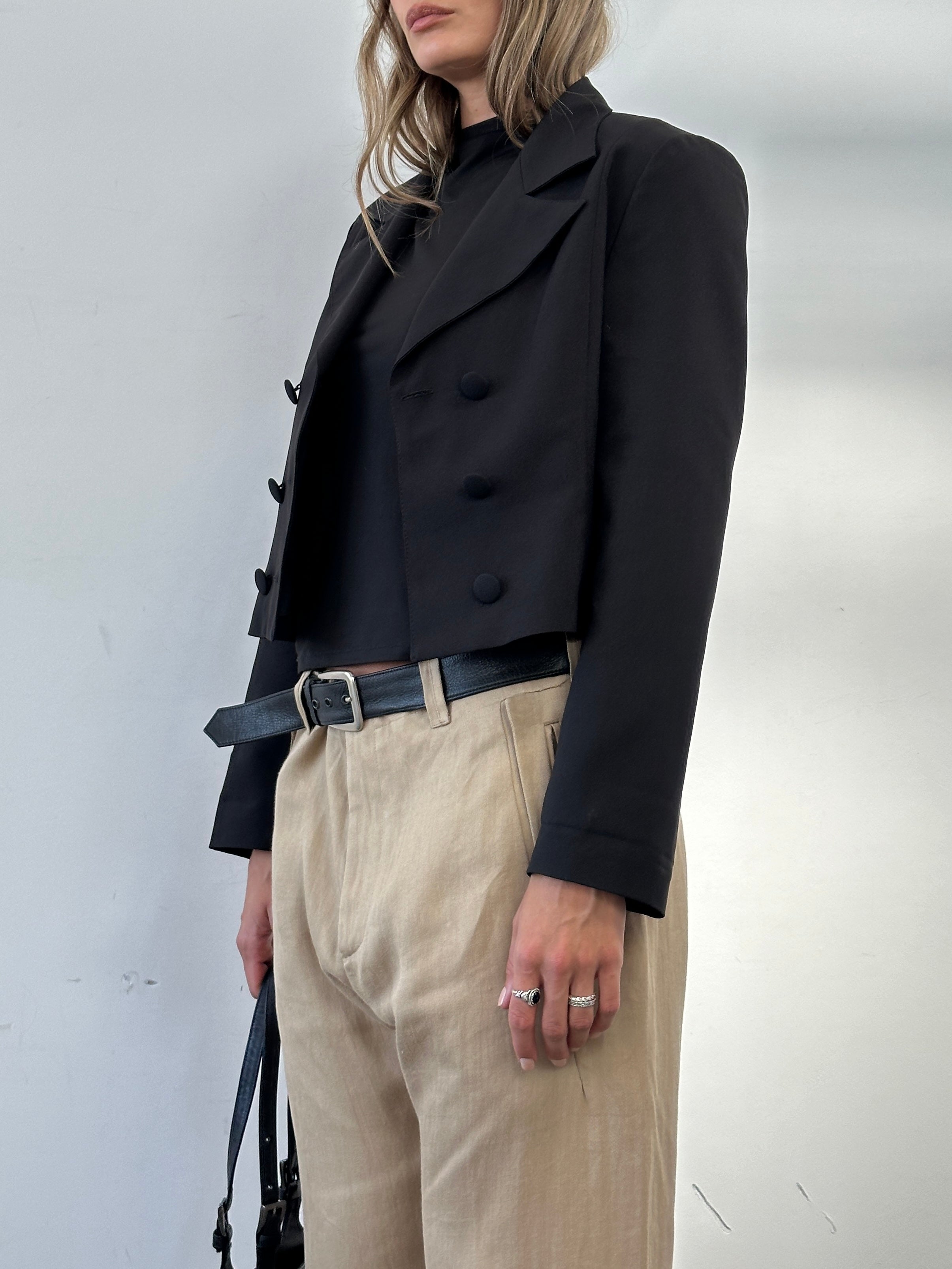Vintage cropped double-breasted blazer in size M, featuring classic lapels and tailored fit, displayed on a hanger.