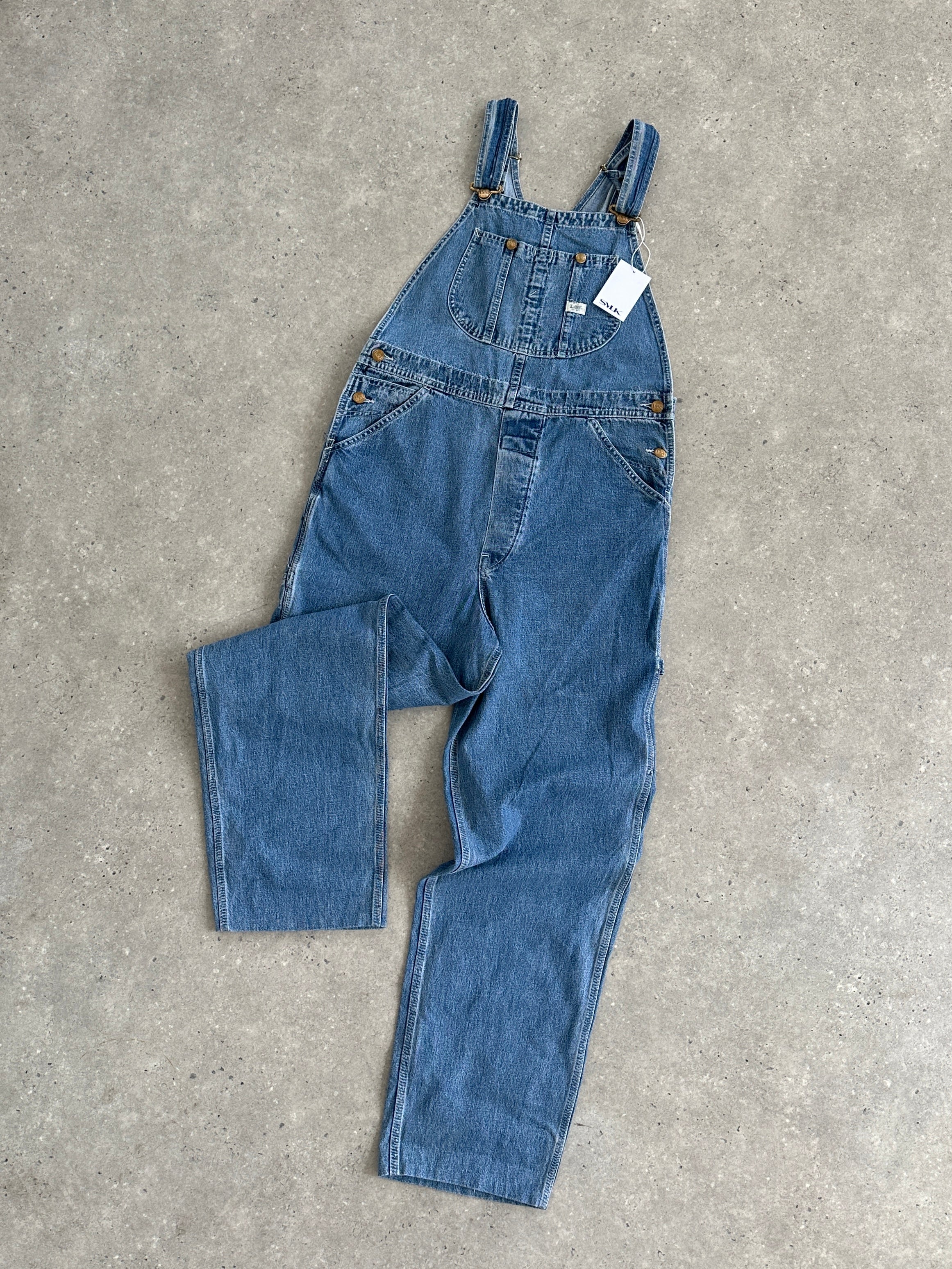 Lee Pure Cotton Denim Dungarees for men, featuring classic blue denim fabric and adjustable straps.
