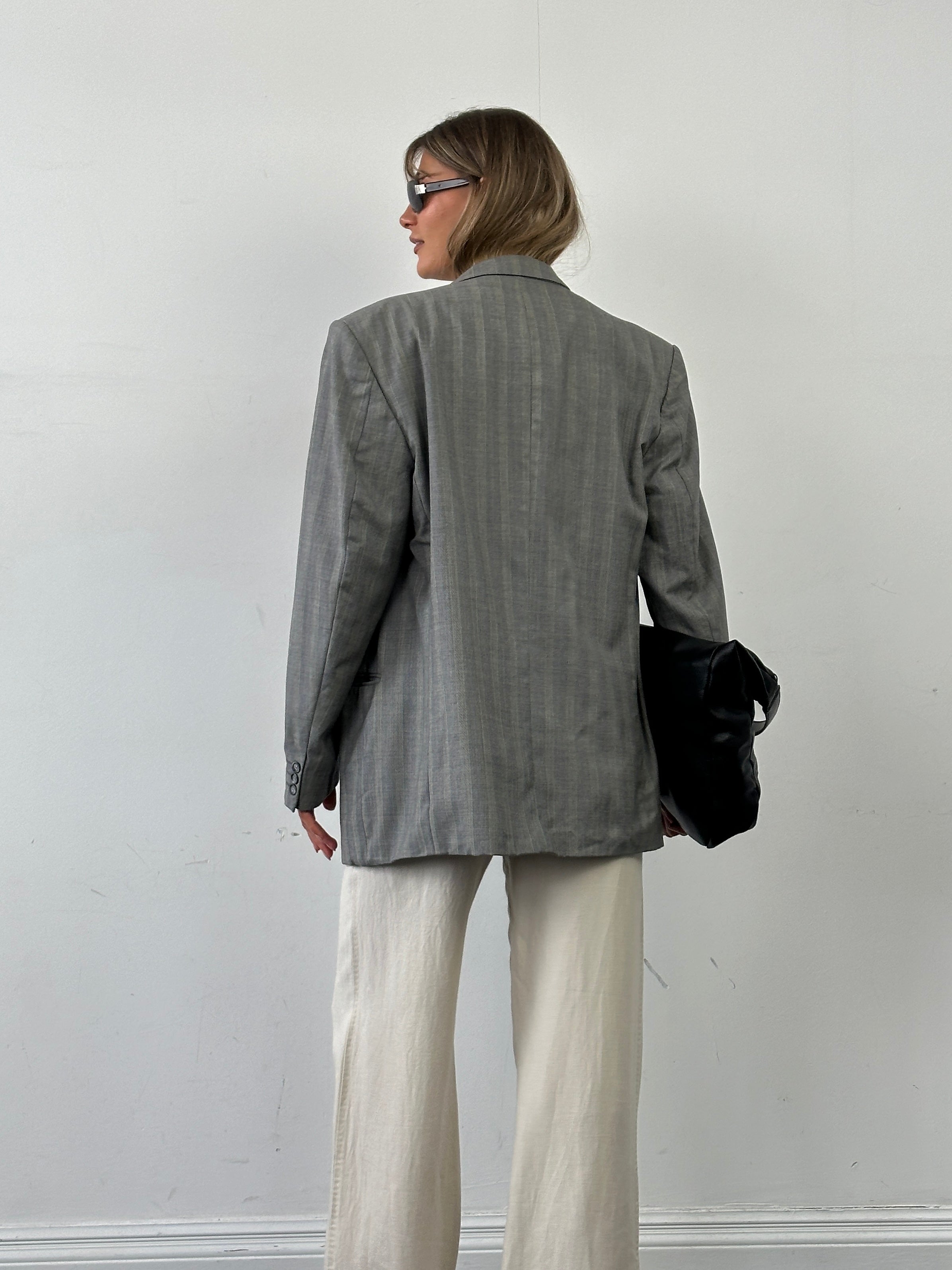 Yves Saint Laurent Pour Homme double-breasted wool blazer in XL, featuring classic stripes and tailored fit