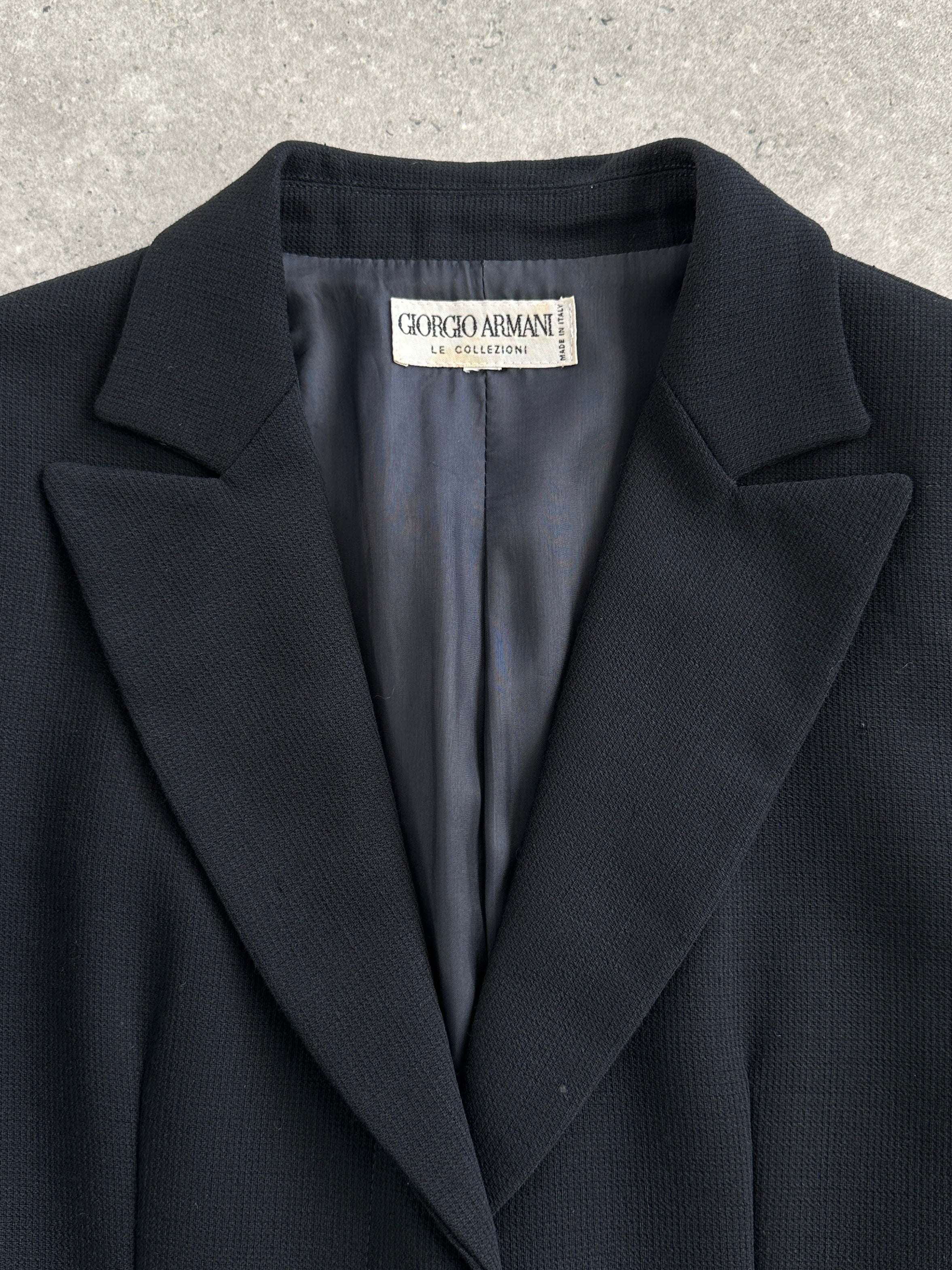 Giorgio Armani Le Collezioni 1990s pure wool single-breasted coat in size S, dark tailored coat displayed on a hanger.