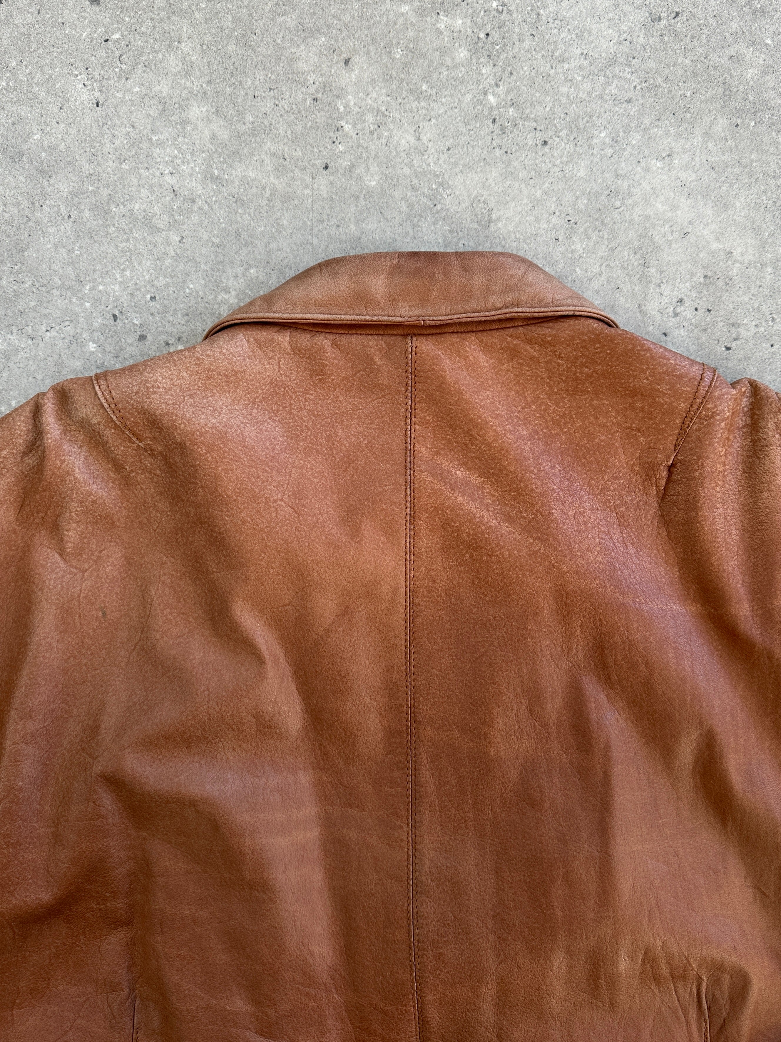 Vintage 1980s leather bomber jacket in size large, featuring classic design and distressed leather from the Vintage brand.
