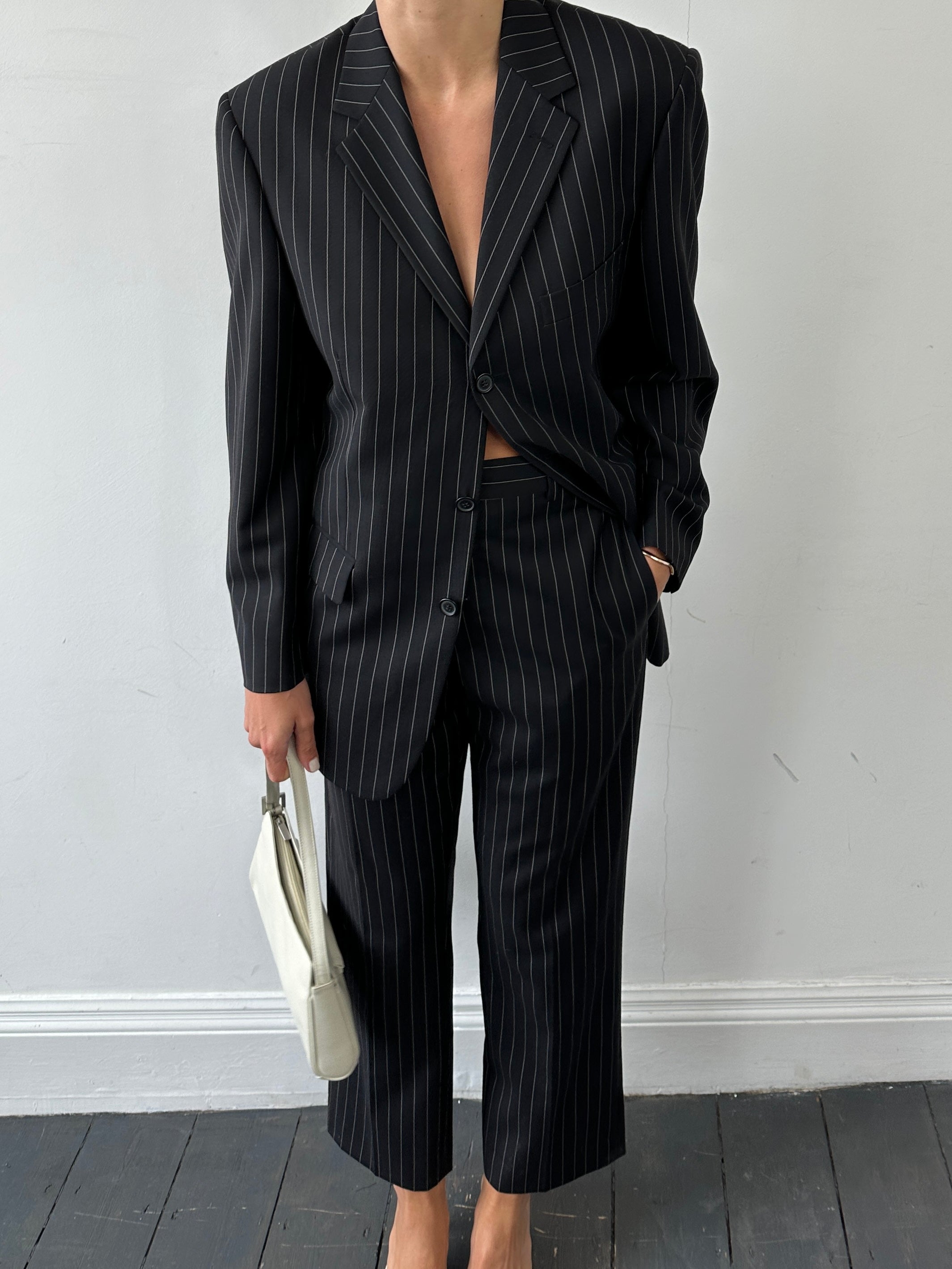 Yves Saint Laurent Pour Homme pinstripe pure wool single-breasted suit in size 38S, featuring a tailored fit and classic lapel design.