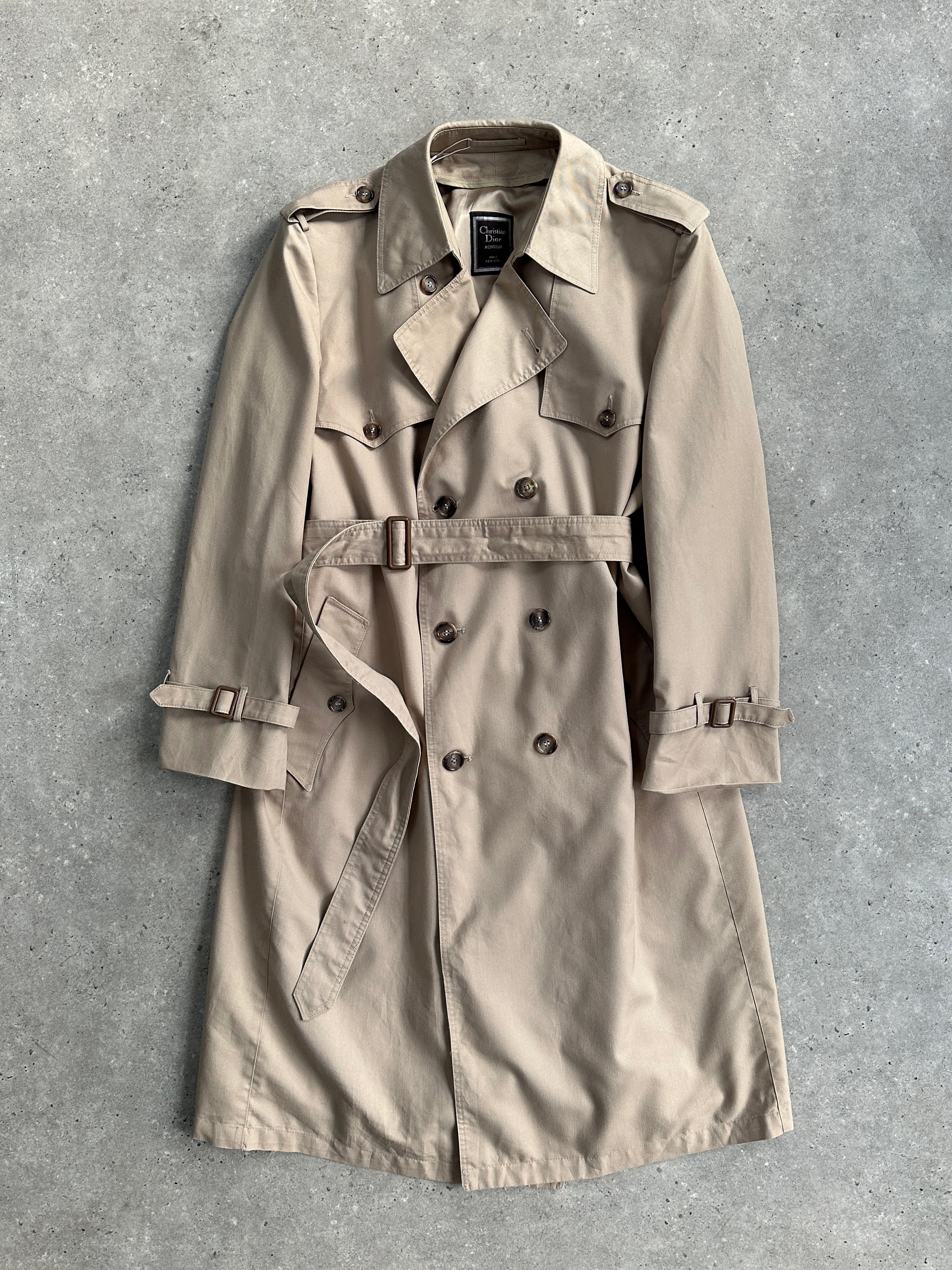 Christian Dior Monsieur cotton double-breasted belted trench coat in XL, shown in beige with classic collar and button details.