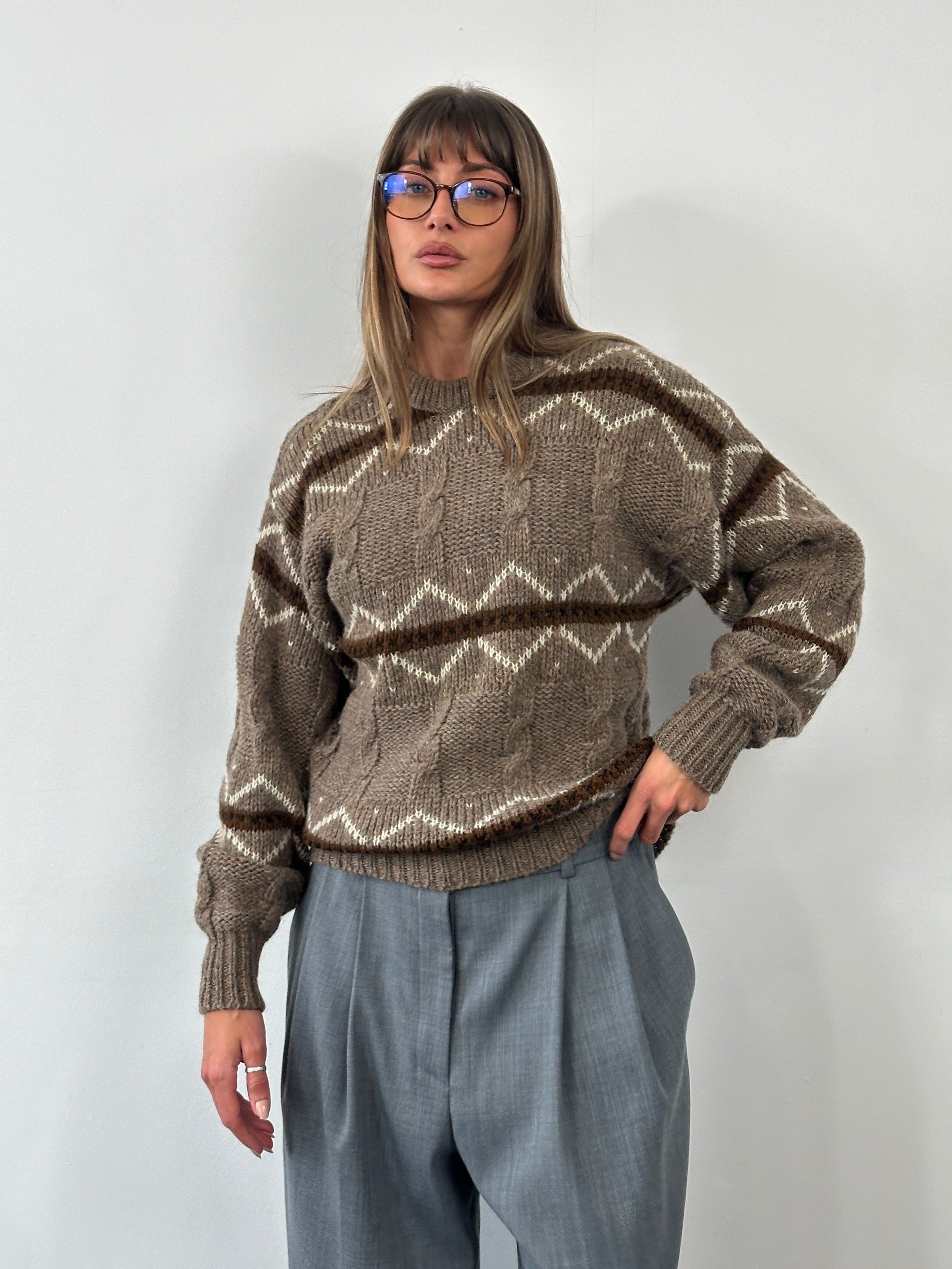 Vintage Italian 1990s pure wool chunky stripe knitted jumper in size L, featuring bold multicolored horizontal stripes and cozy knit texture.