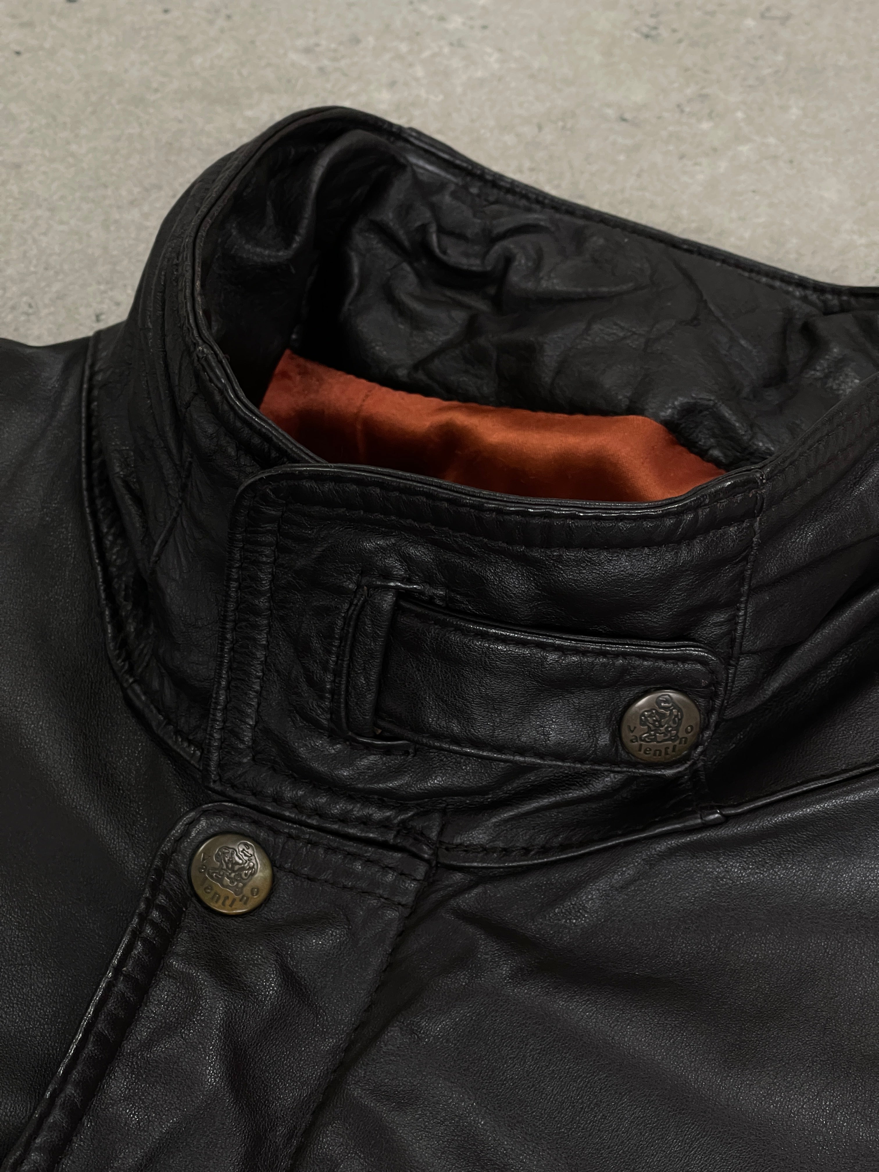 Valentino 1990s high neck leather bomber jacket in black, featuring a fitted design and classic leather texture.