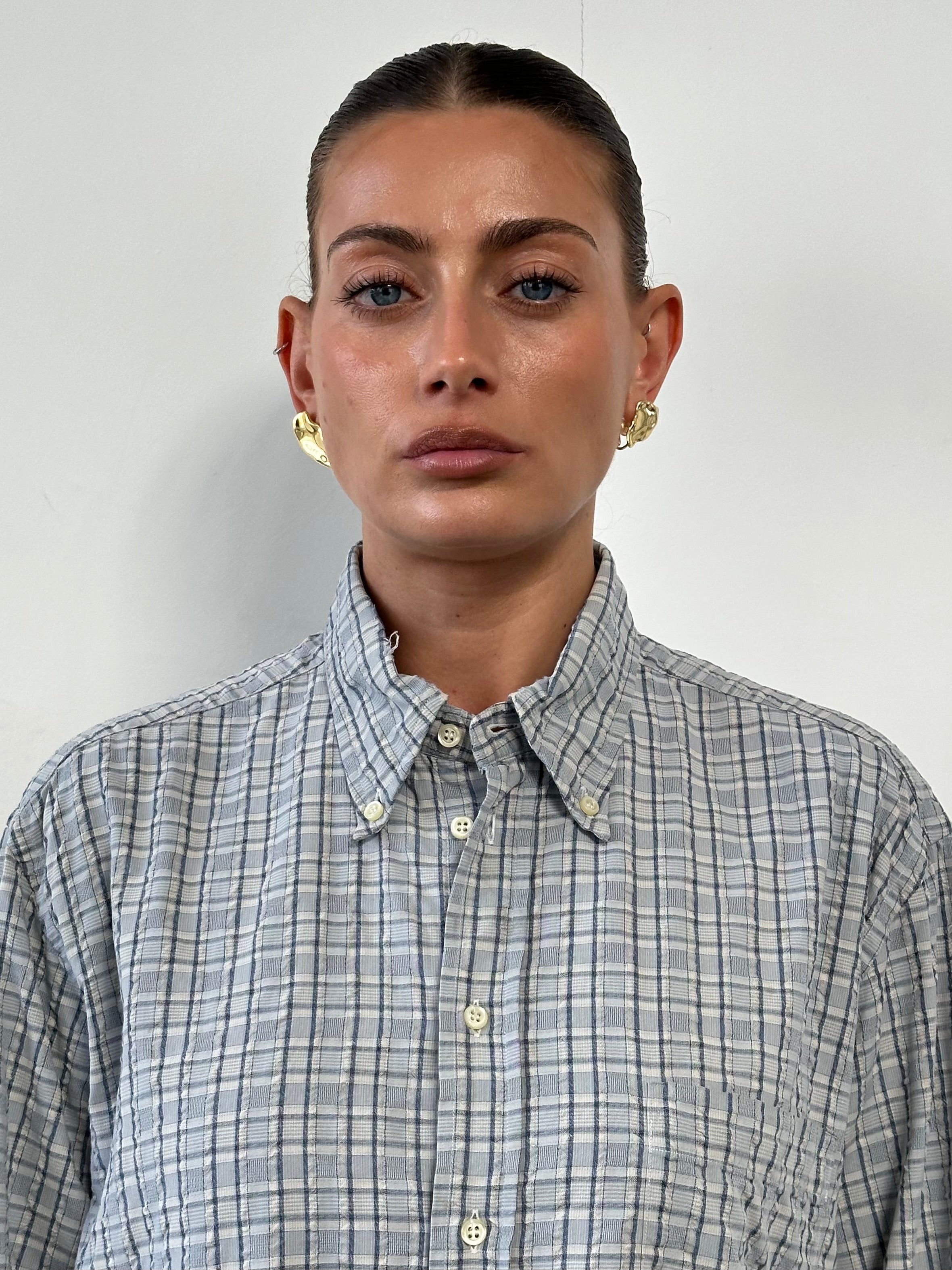 Giorgio Armani check pure cotton shirt in size large, featuring classic pattern and tailored collar, displayed on a hanger.