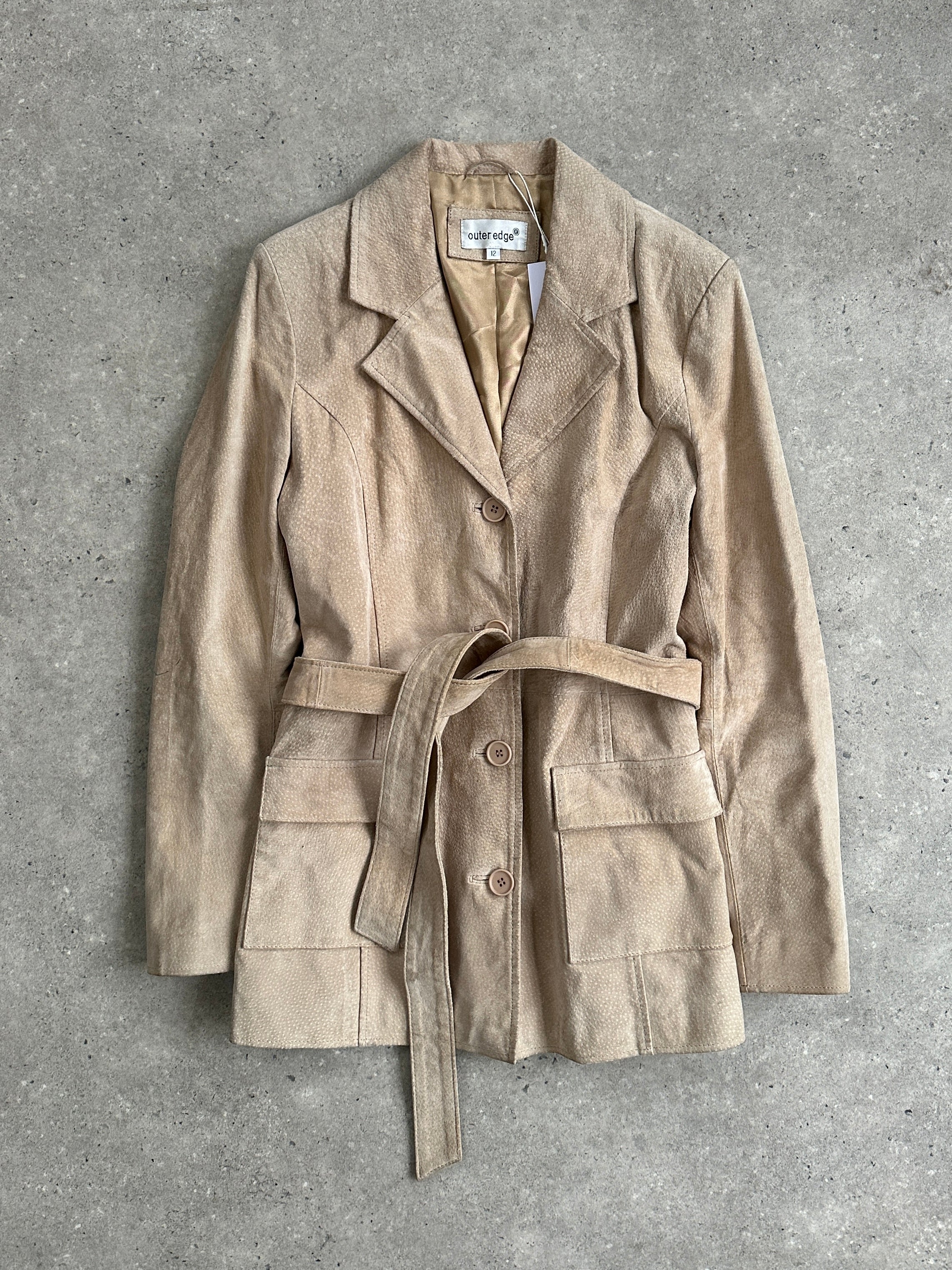 Vintage belted suede jacket in size M, featuring classic design and textured suede material, styled for a timeless look.